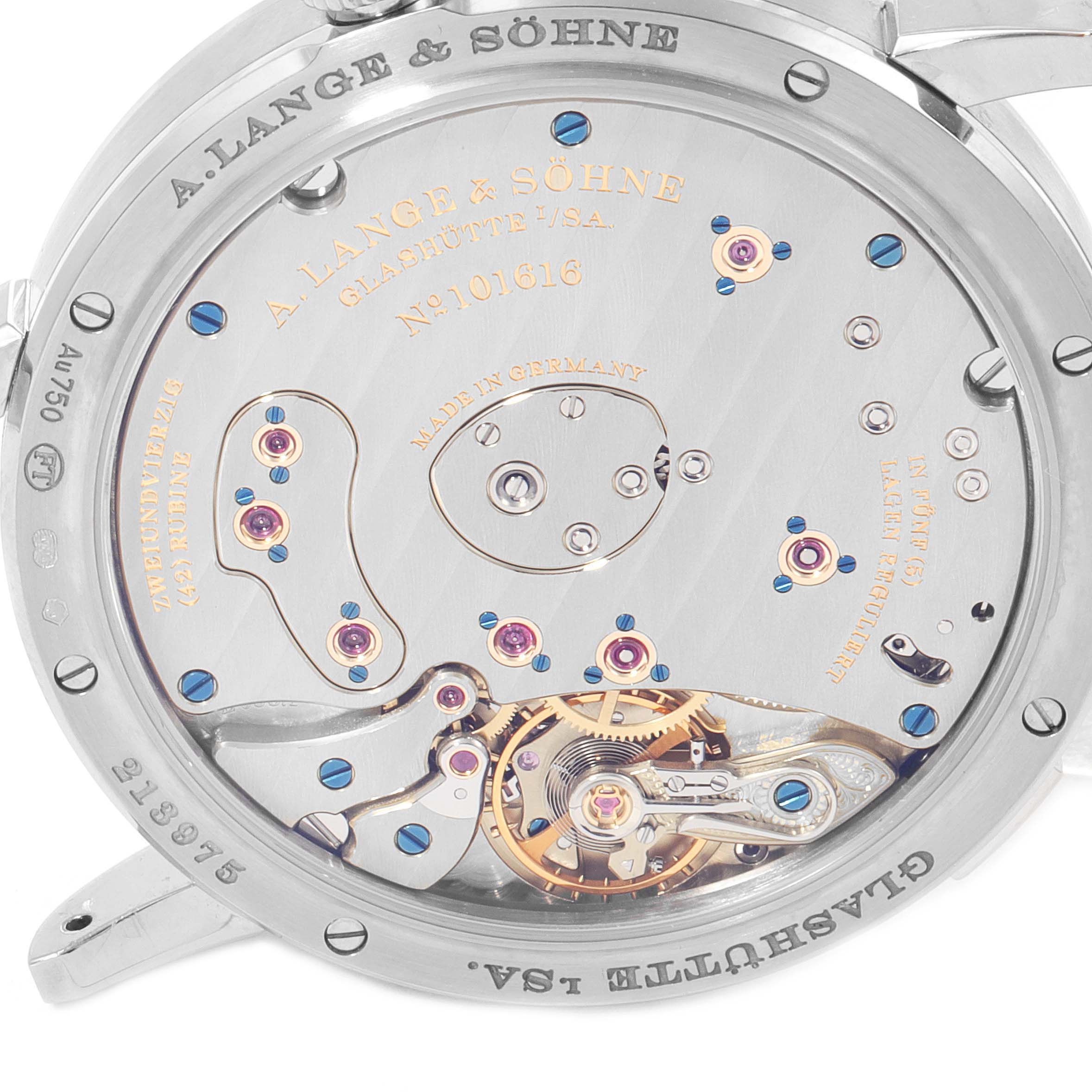 The image shows the intricate movement and inner workings of the A. Lange & Sohne Lange 1 117.028 Men's White Gold Black Dial watch from a back angle.