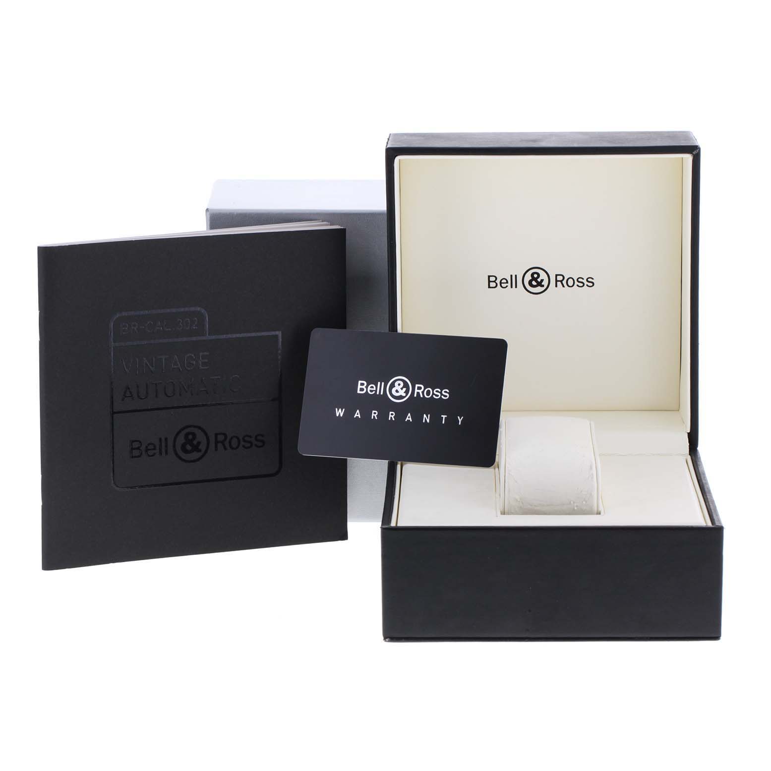 The image displays the packaging, warranty card, and manual for a Bell & Ross Vintage model watch.