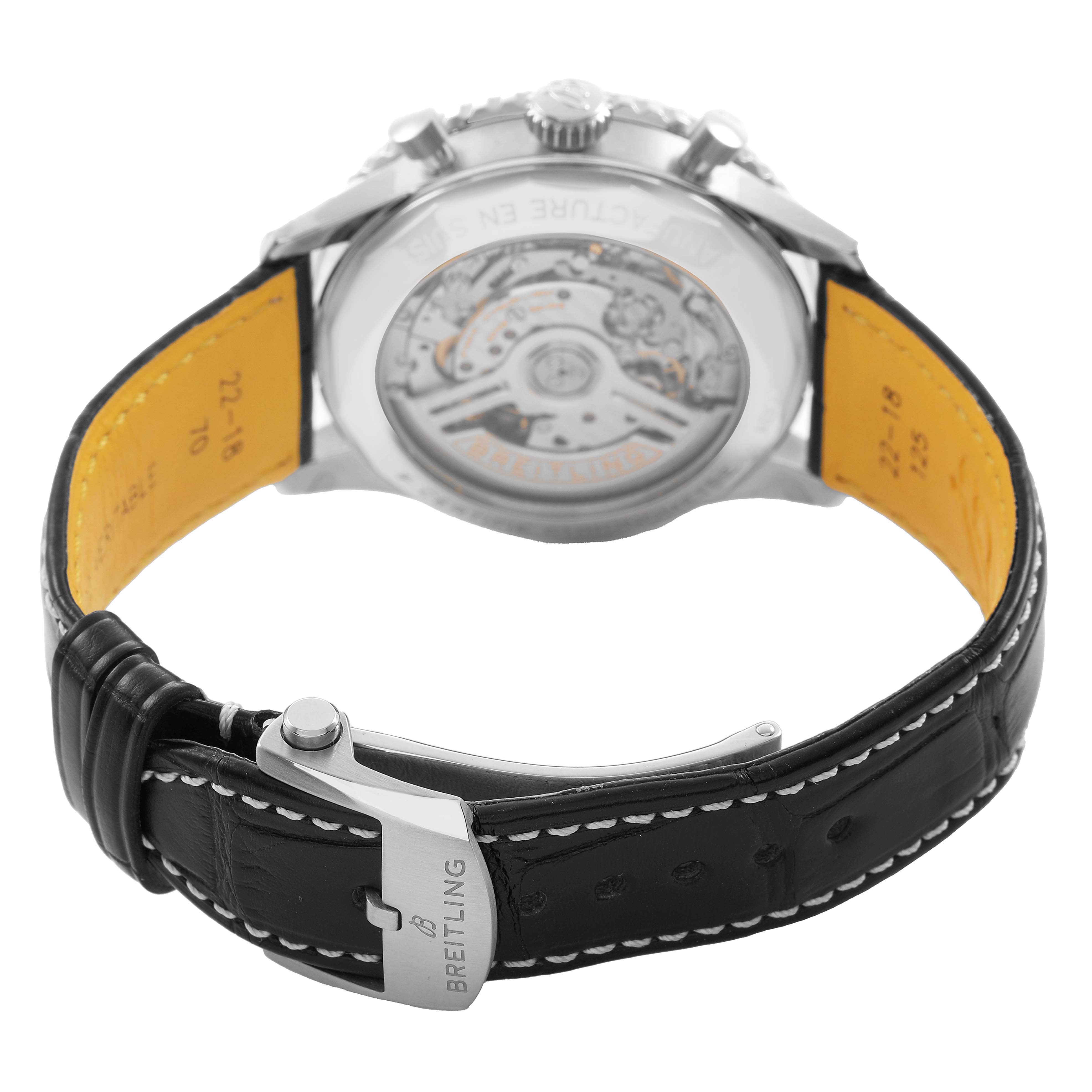 The image shows the Breitling Navitimer AB0138 Men's Stainless Steel Blue Dial watch from the back, highlighting the open case back and black leather strap with buckle.