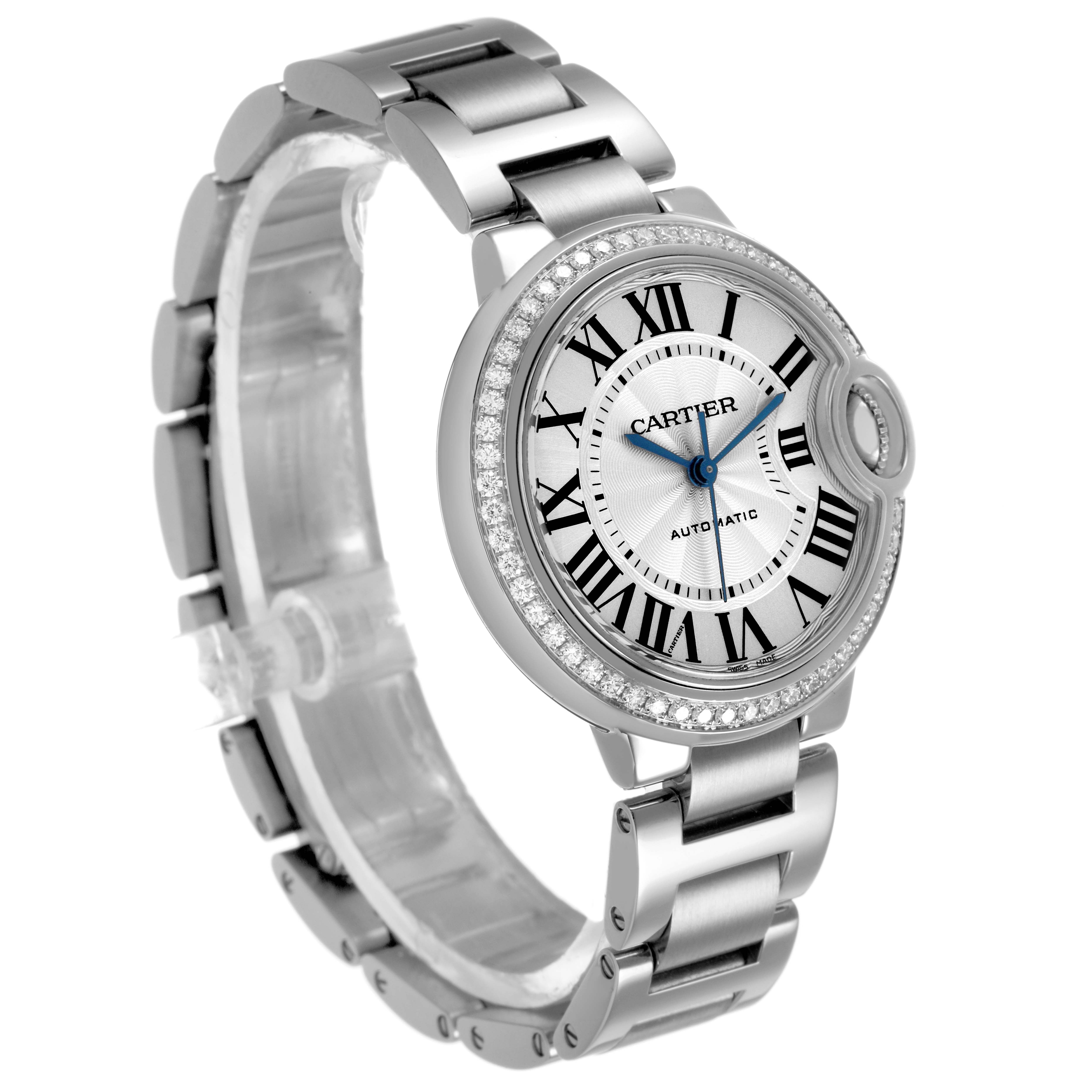 The Ballon Bleu de Cartier watch is shown at a slight angle, highlighting the bezel, dial, crown, and metal bracelet.