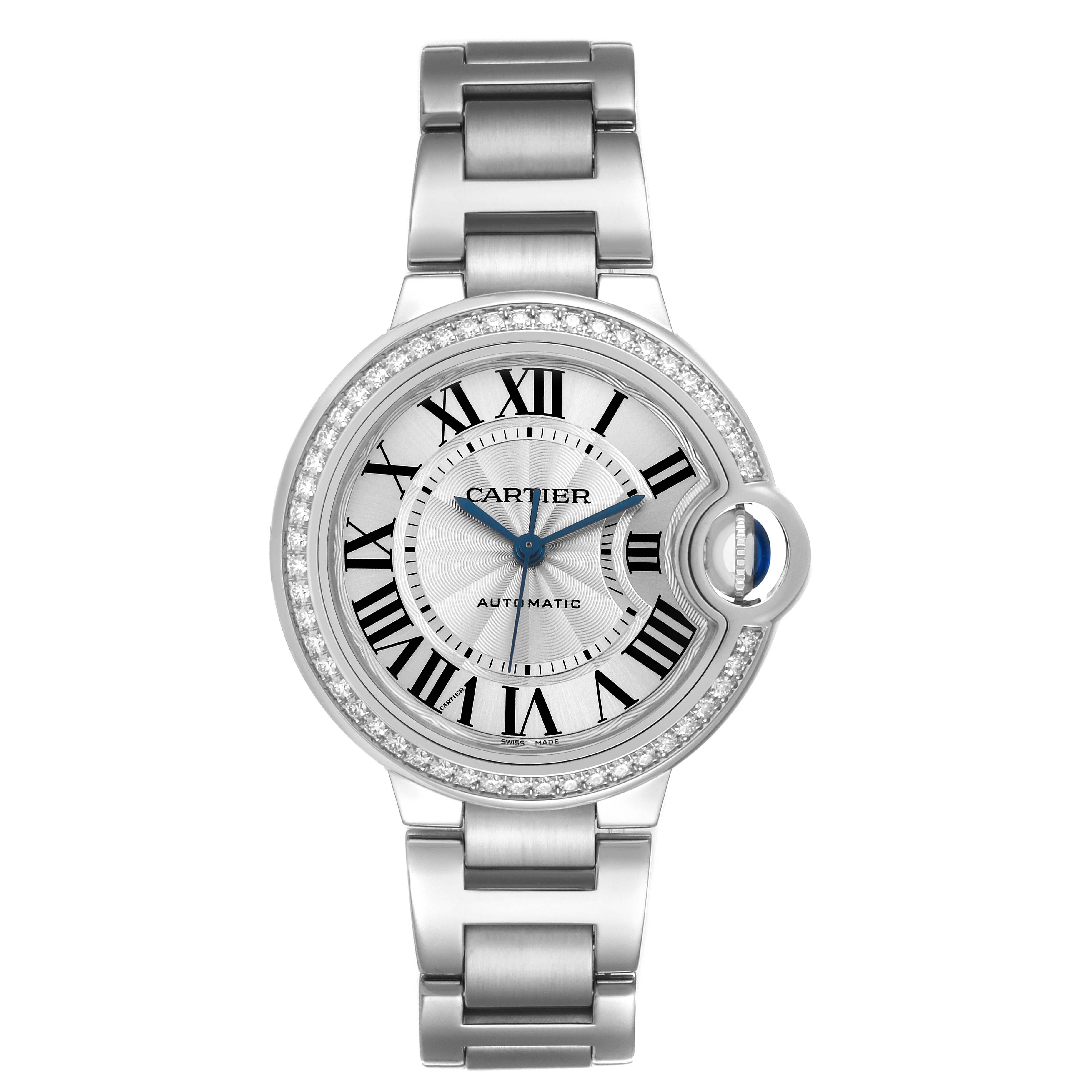 The Ballon Bleu by Cartier is shown from a top angle, highlighting the round face, Roman numerals, and metal bracelet.