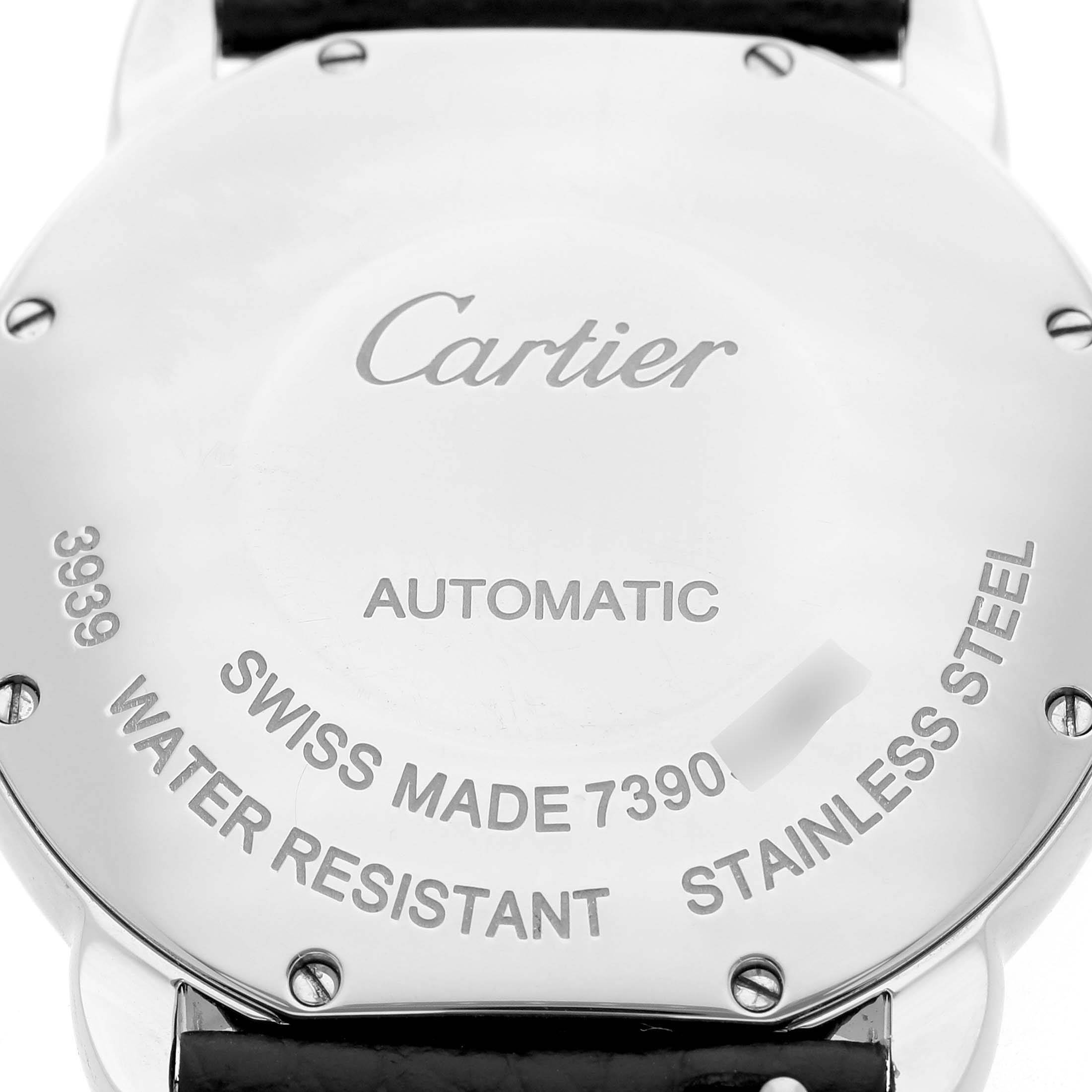 The image shows the back case of a Cartier Ronde WSRN0021 Men's Stainless Steel Silver Dial watch, displaying engravings and screws.