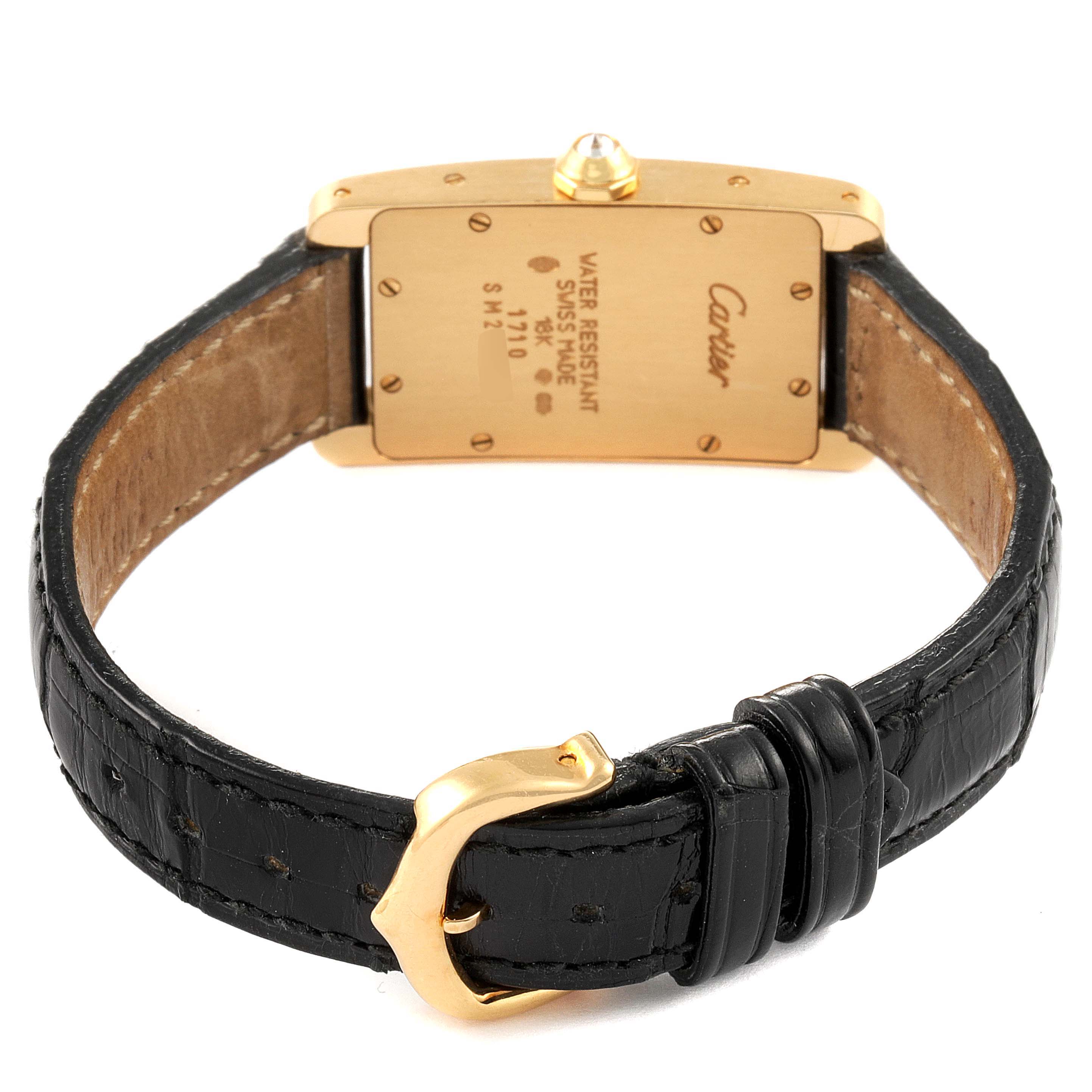 The image shows the back view of a Cartier Tank Americaine WB701251 Women's Yellow Gold Silver Dial WB701251 Women's Yellow Gold Silver Dial watch, highlighting the clasp, strap, and case back.