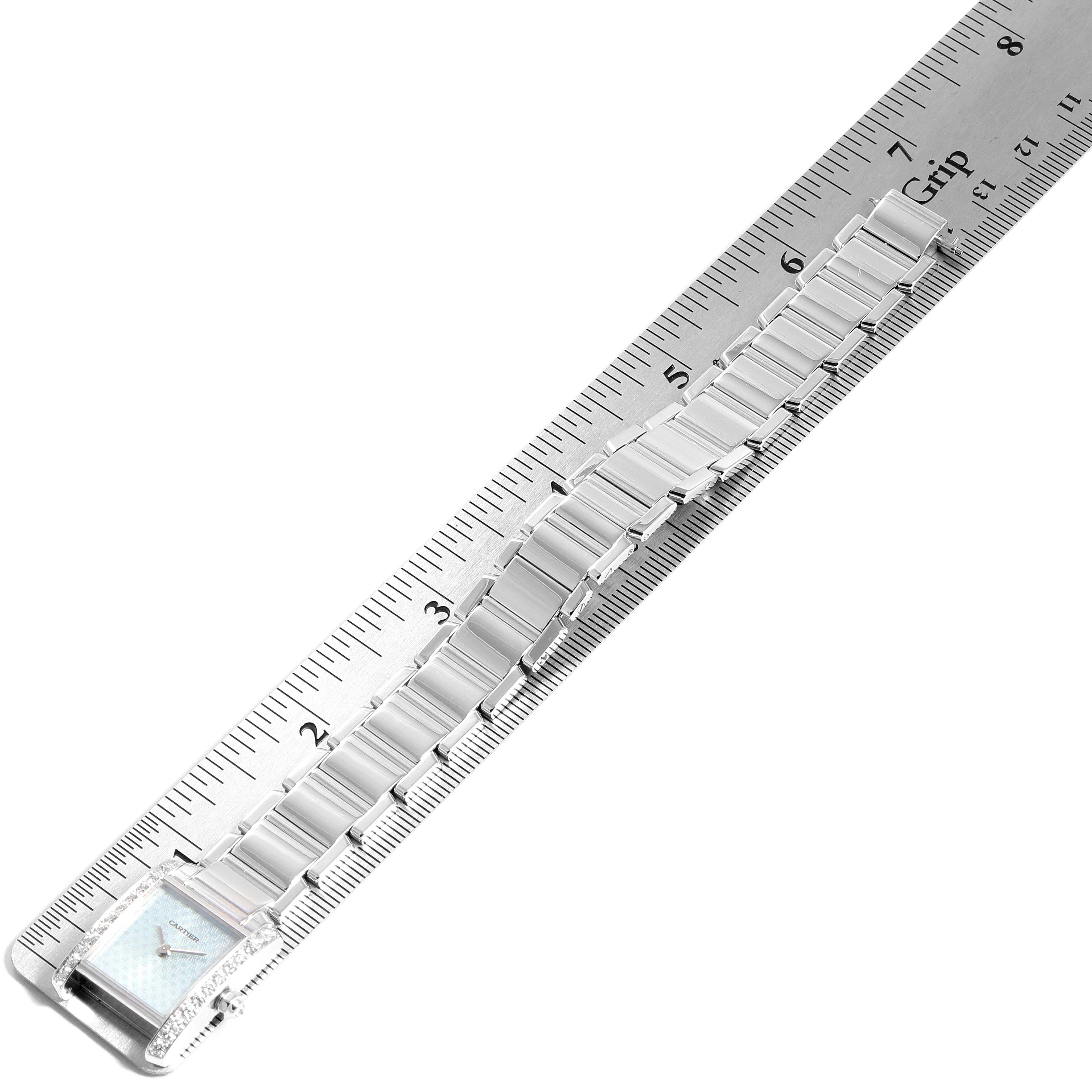 This image shows the face and band of a Cartier Tank Francaise 2403 Men's White Gold Blue Dial 2403 Men's White Gold Blue Dial watch, measured against a ruler.