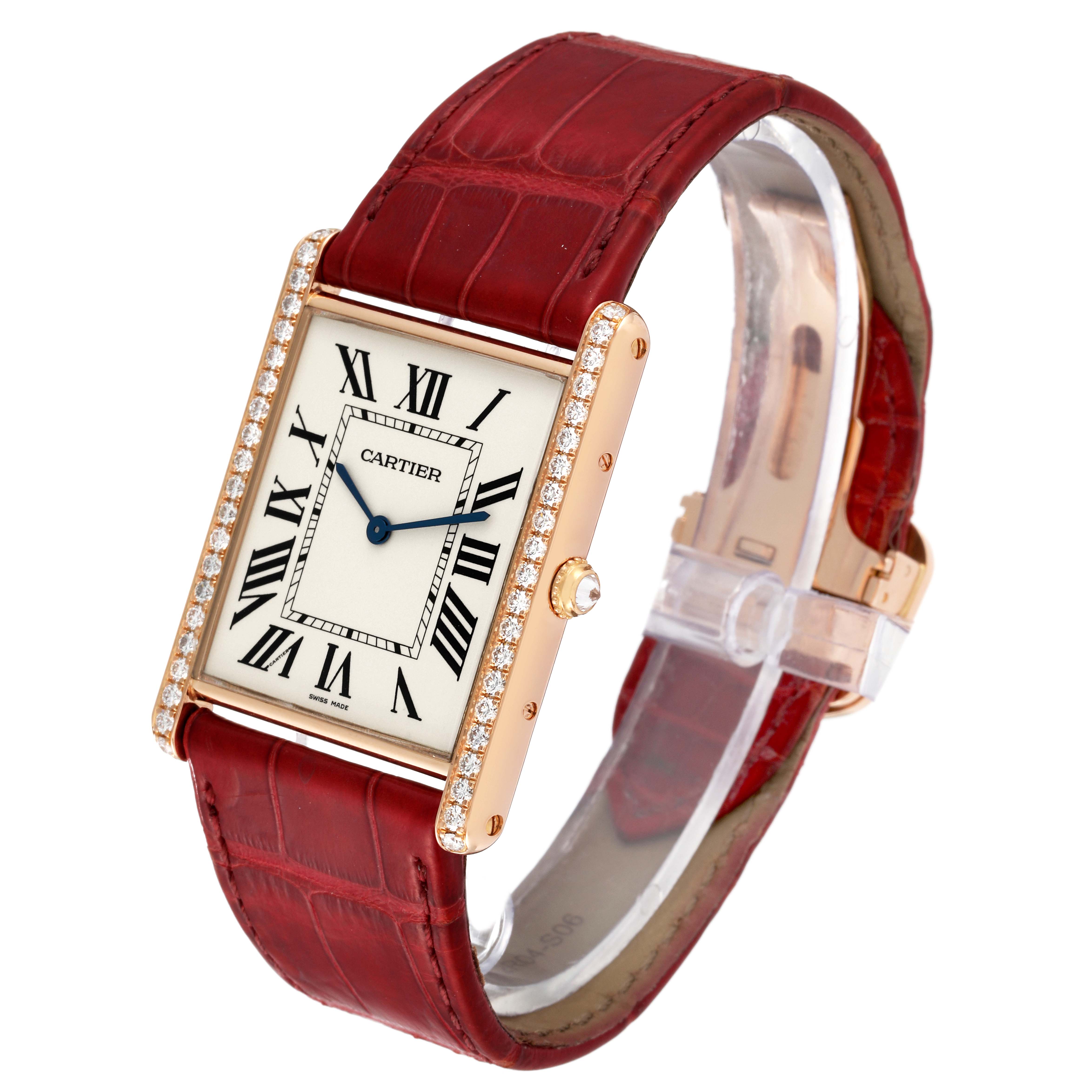 The Cartier Tank Louis WT200005 Men's Rose Gold Silver Dial WT200005 Men's Rose Gold Silver Dial watch is shown at an angled view, displaying the face, bezel with diamonds, and red leather strap.
