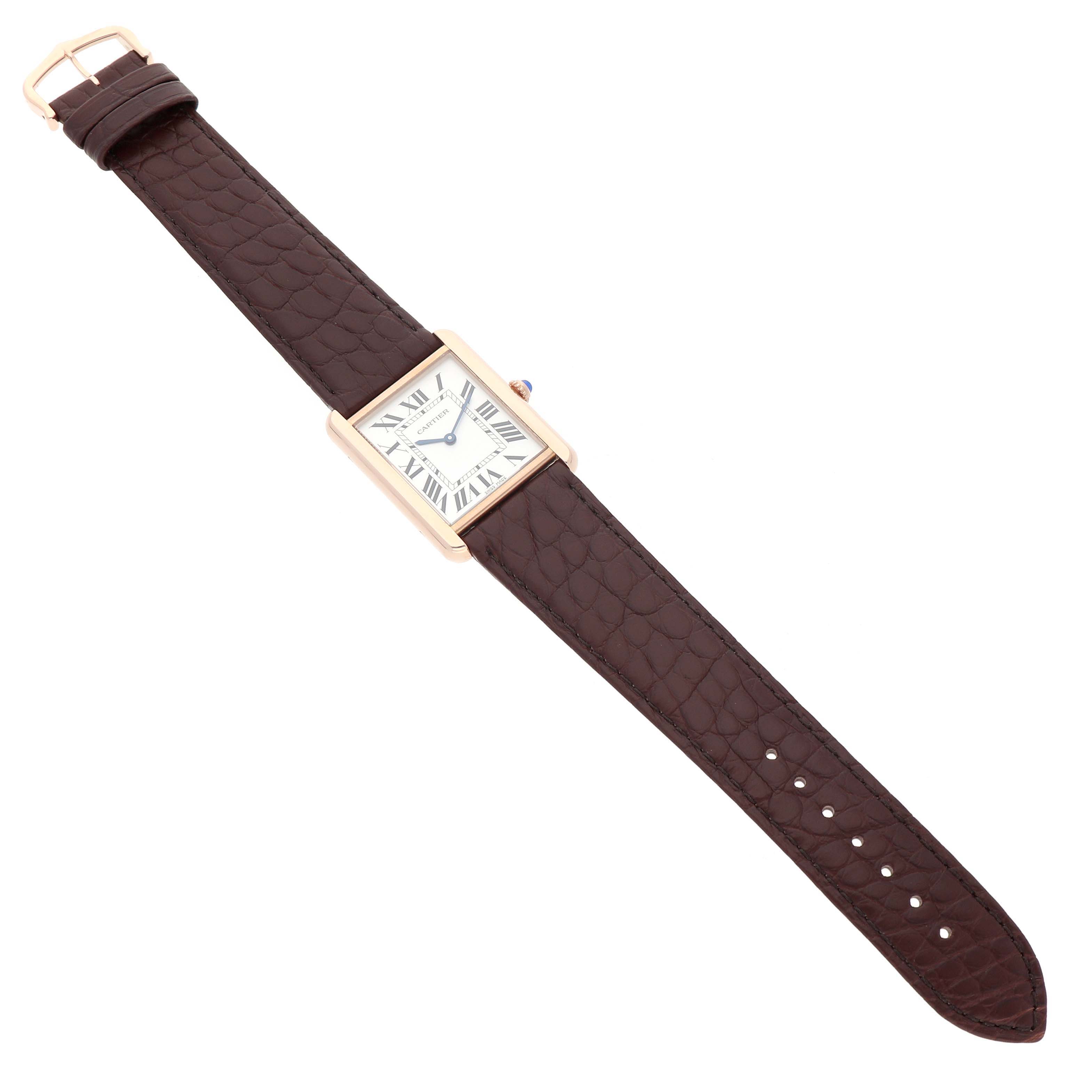 The Cartier Tank Solo W5200025 Men's Steel and Gold (two tone) Silver Dial watch is shown at an angled top view, displaying the face, case, and brown leather strap fully extended.