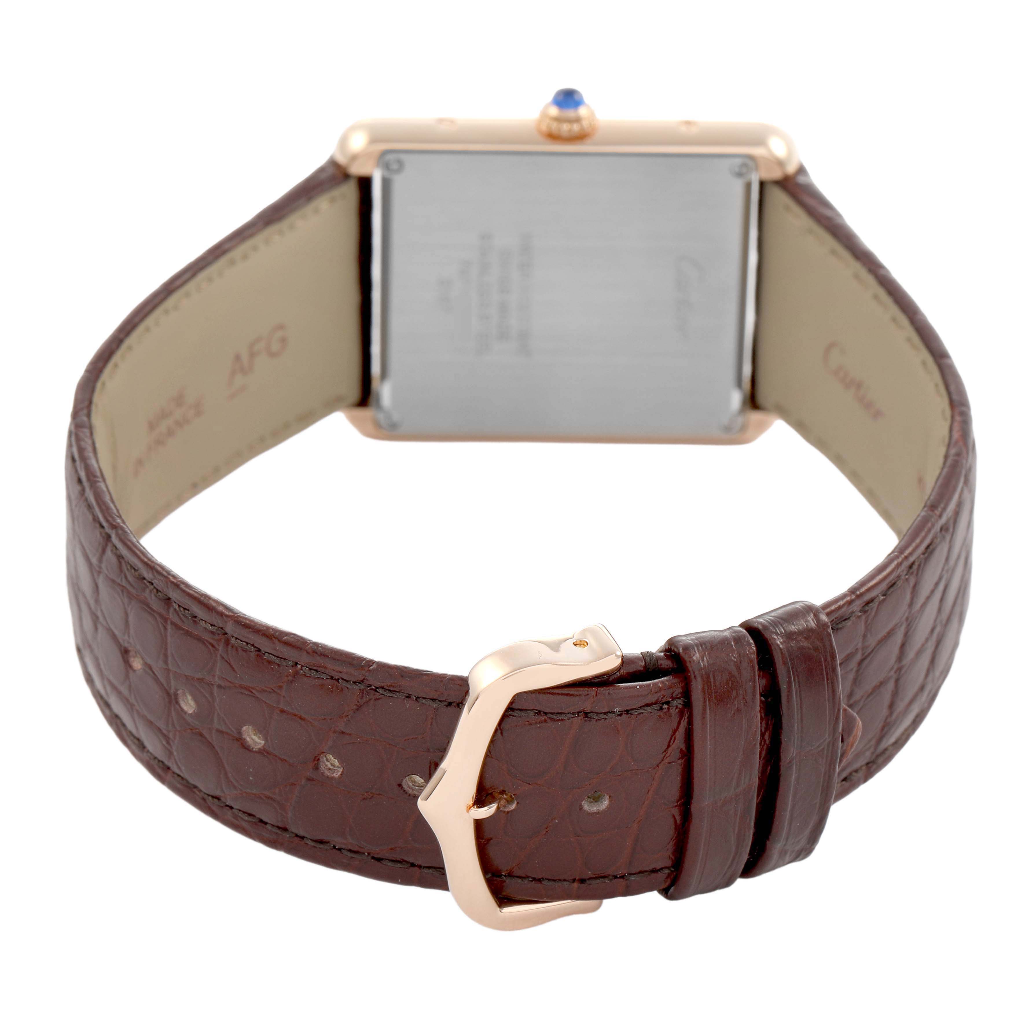 The image shows the back view of a Cartier Tank Solo W5200025 Men's Steel and Gold (two tone) Silver Dial watch, highlighting its leather strap and buckle.