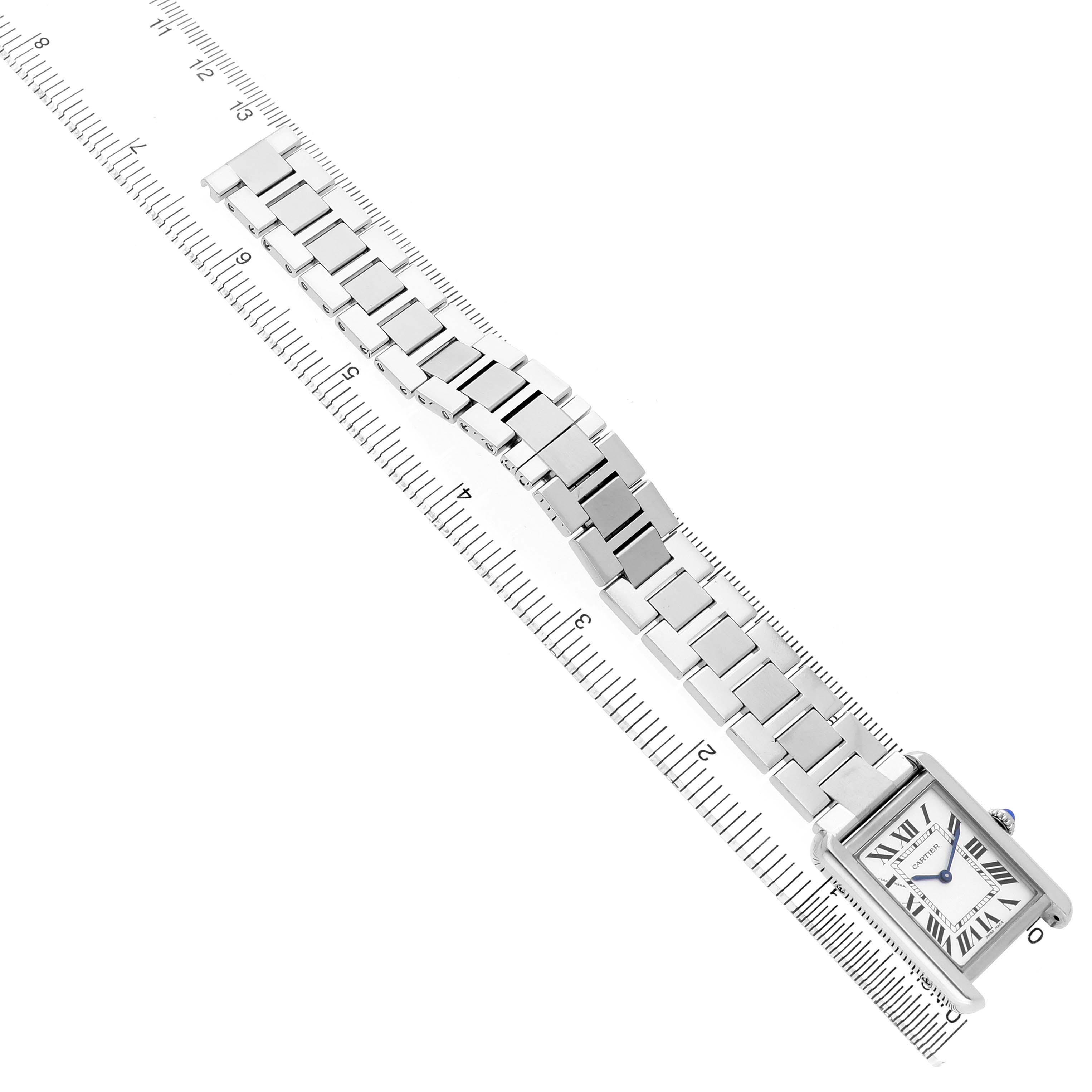 The Cartier Tank Solo W5200013 Women's Stainless Steel Silver Dial watch is shown from an overhead view, highlighting its face and metal bracelet.