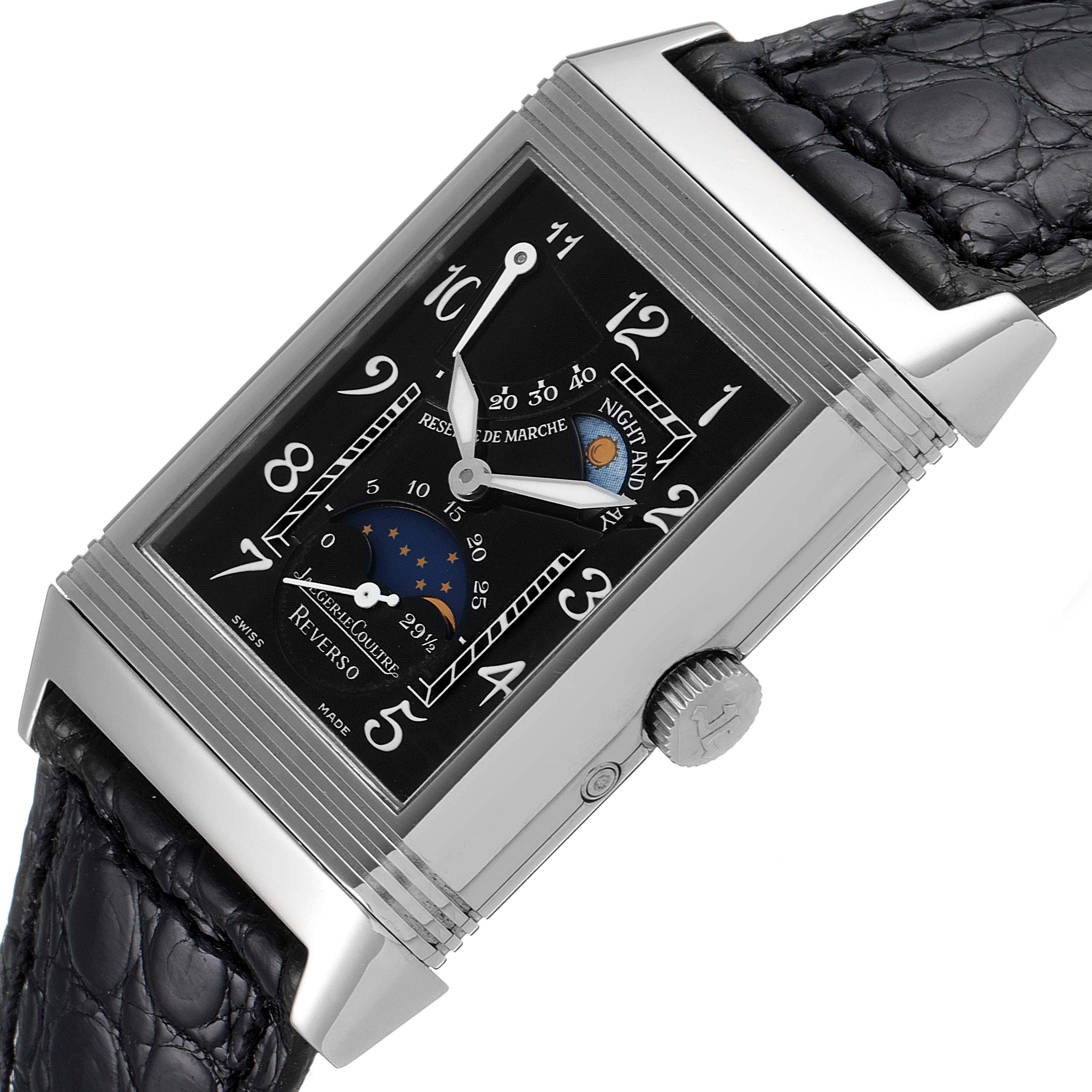 The image shows a close-up of a Jaeger LeCoultre Reverso Q2753470 Men's White Gold Black Dial Q2753470 Men's White Gold Black Dial watch, highlighting its face, crown, and part of the strap.