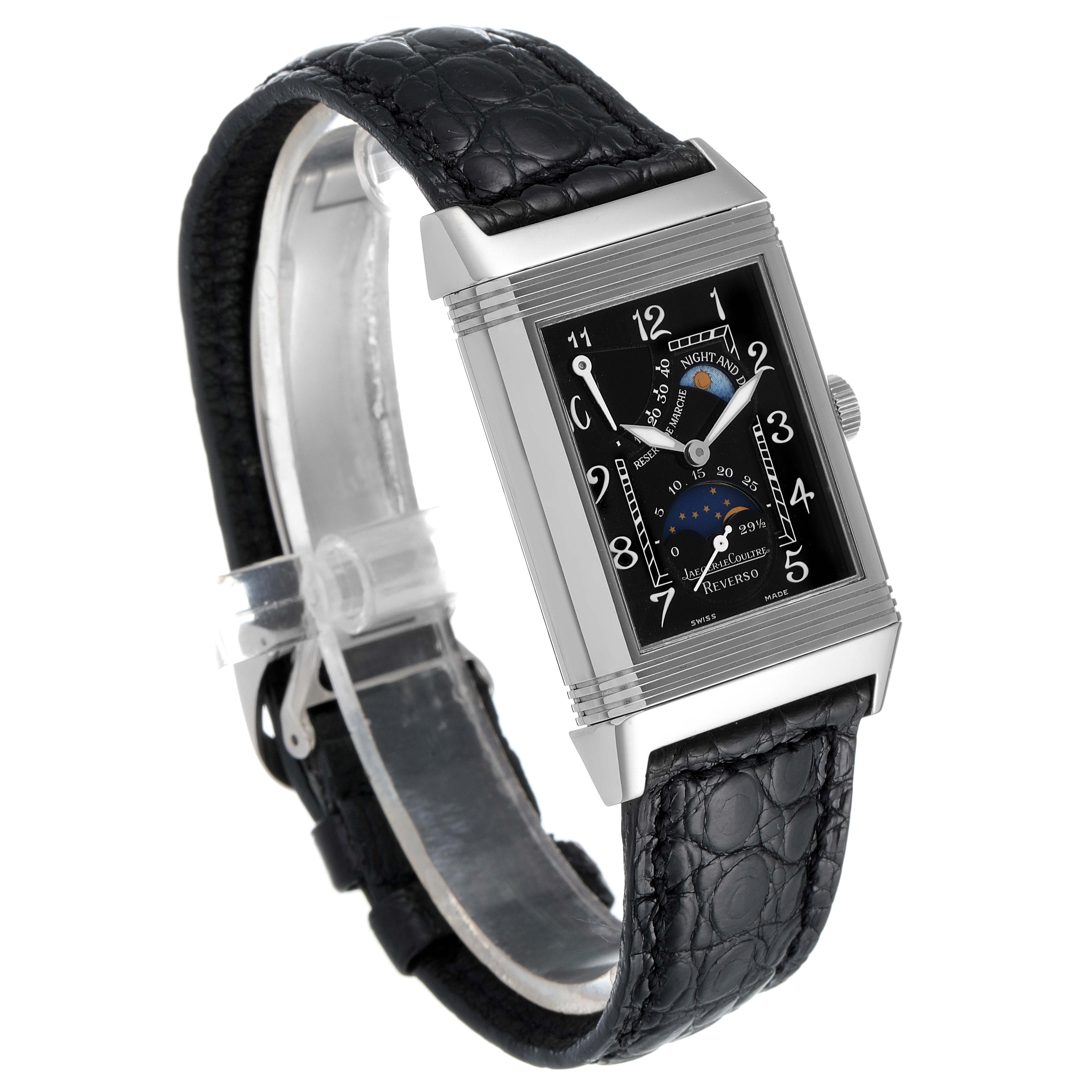 The Jaeger-LeCoultre Reverso watch is shown at a three-quarter angle, displaying its black dial, stainless steel case, and black leather strap.