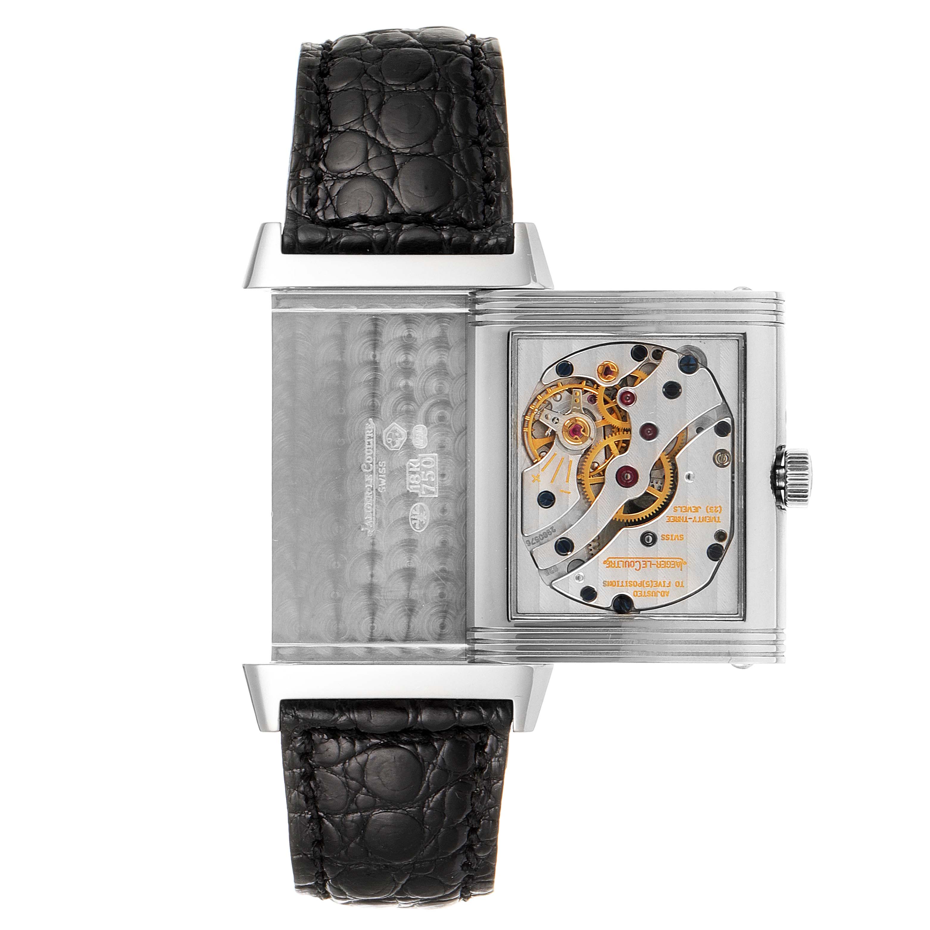 The image shows the back of a Jaeger LeCoultre Reverso Q2753470 Men's White Gold Black Dial Q2753470 Men's White Gold Black Dial watch, highlighting the exposed movement and leather strap at flat angle.