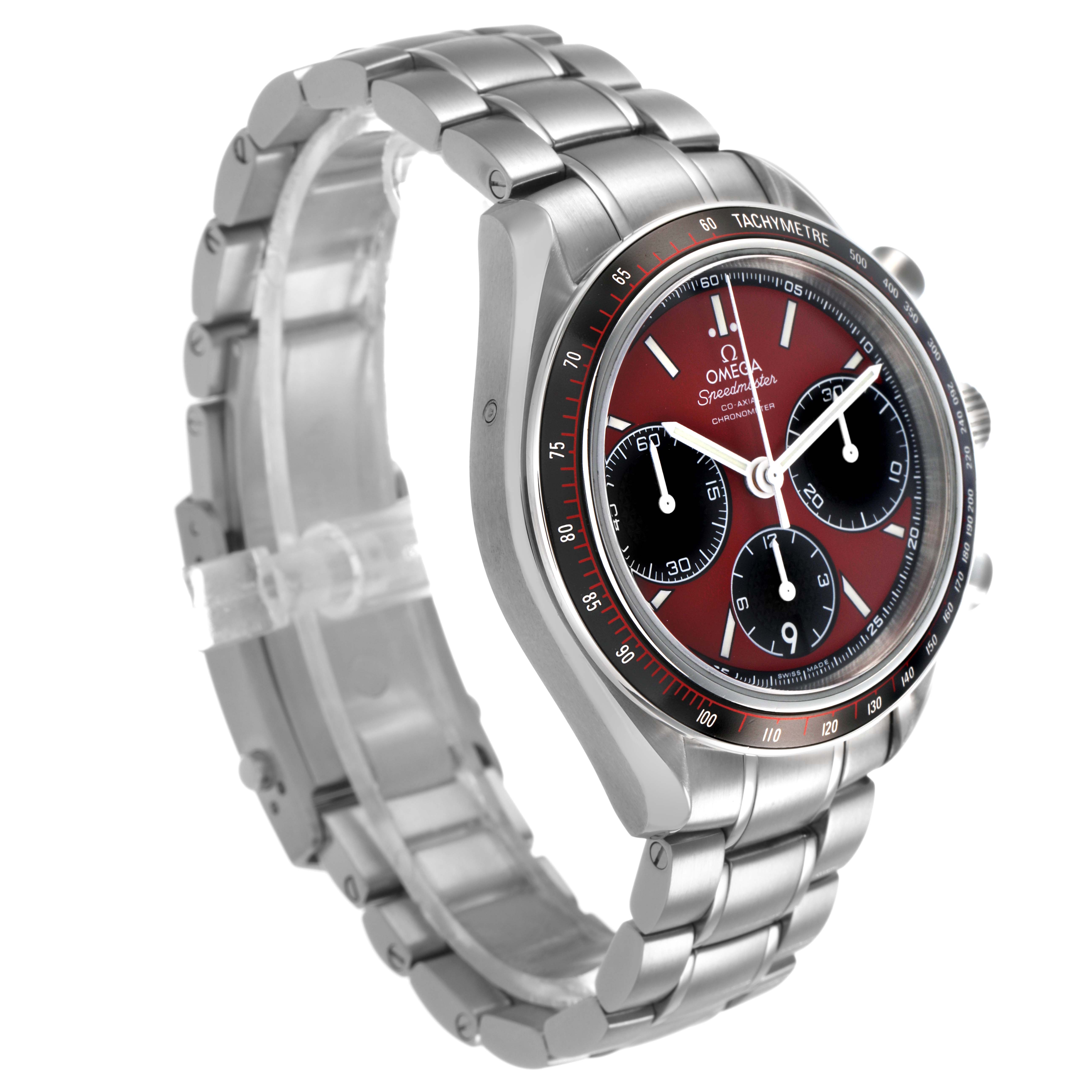 The Omega Speedmaster 326.30.40.50.11.001 Men's Stainless Steel Red Dial watch is shown at a three-quarter angle, highlighting the case, dial, and bracelet.