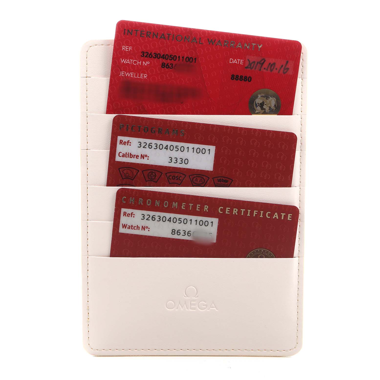 The image shows a cardholder containing warranty and certification cards for the Omega Speedmaster 326.30.40.50.11.001 Men's Stainless Steel Red Dial model.