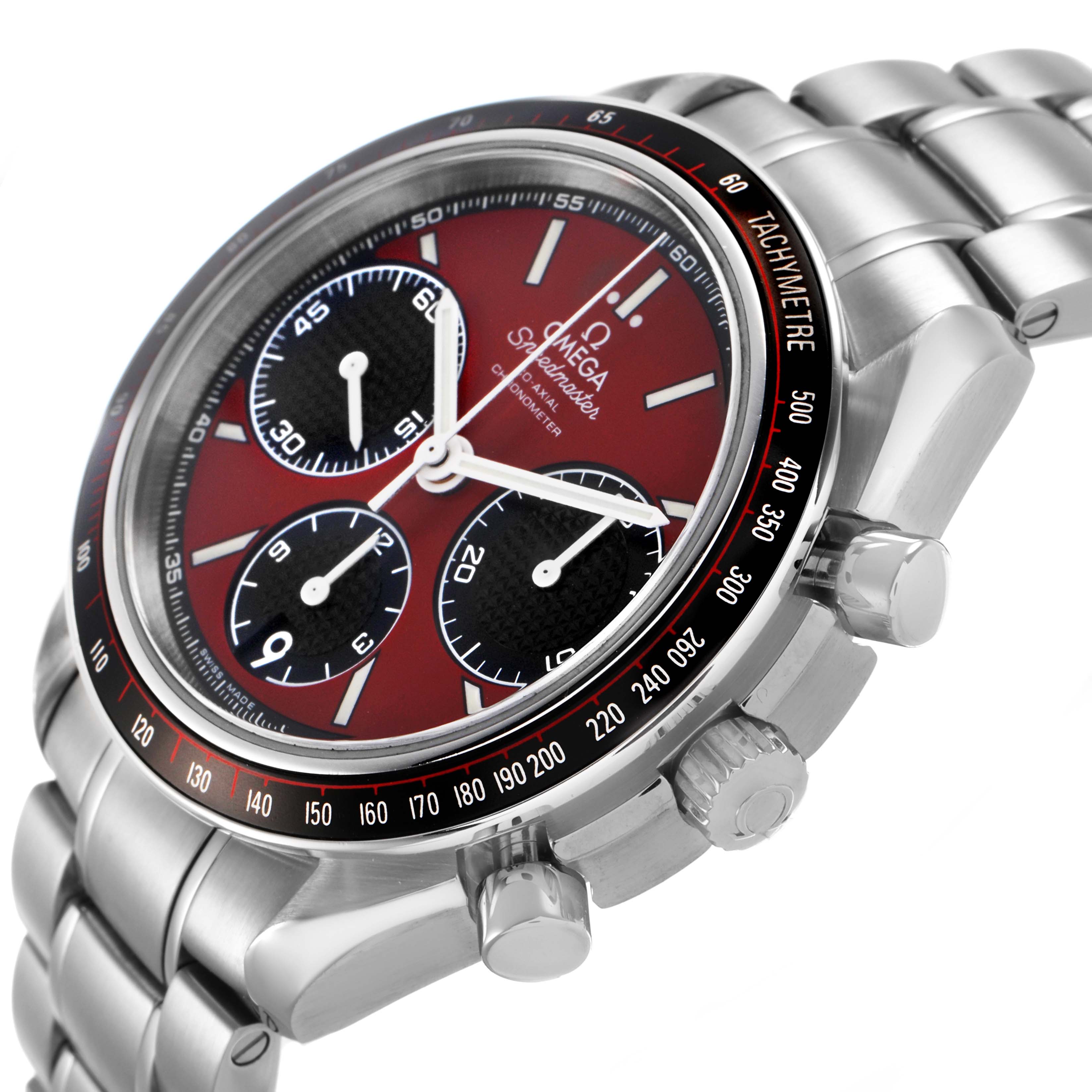 The Omega Speedmaster 326.30.40.50.11.001 Men's Stainless Steel Red Dial watch is shown at a three-quarter angle, highlighting the red dial, subdials, bezel, crown, and stainless steel bracelet.