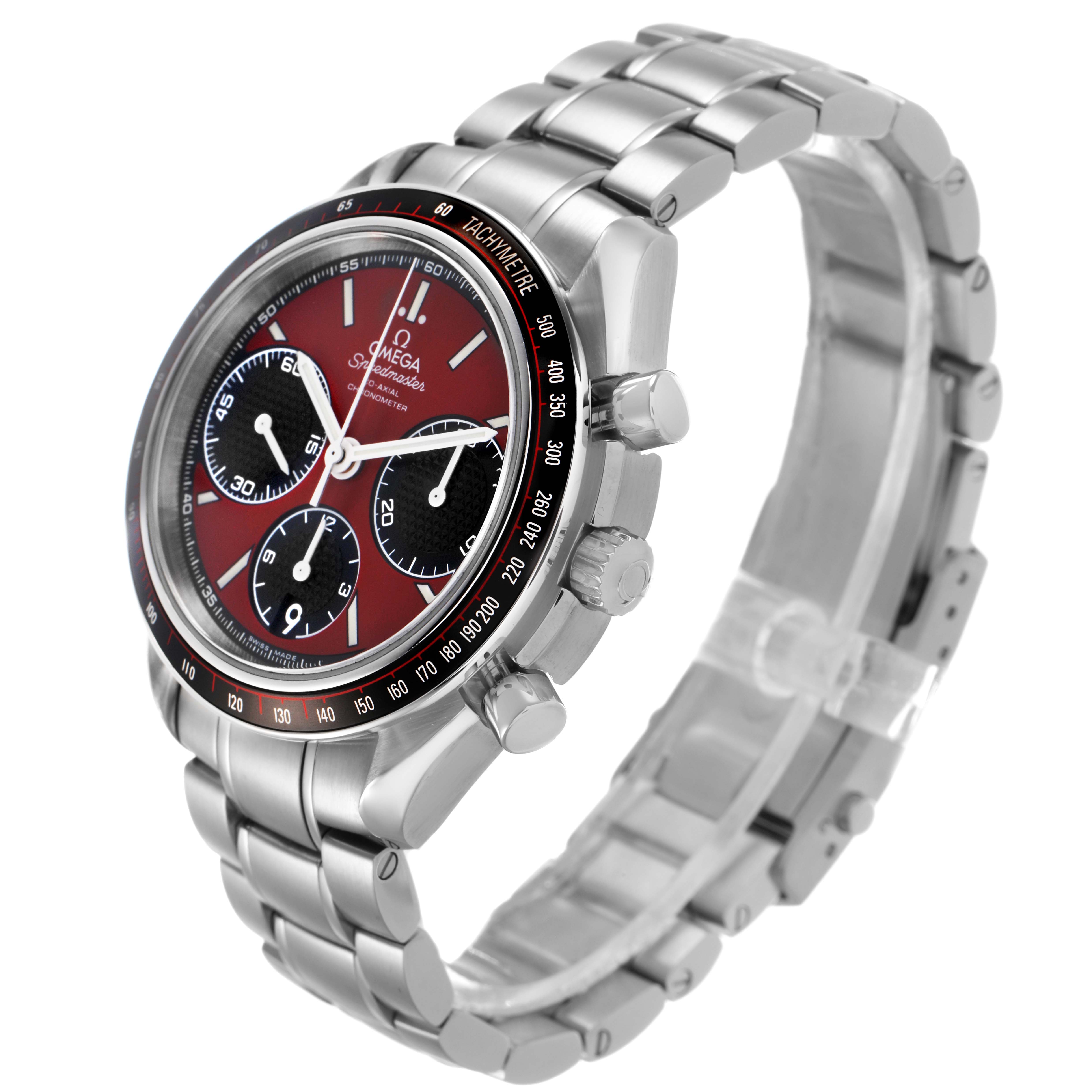 The Omega Speedmaster 326.30.40.50.11.001 Men's Stainless Steel Red Dial watch is shown at a three-quarter angle, highlighting the face, bezel, crown, and part of the bracelet.
