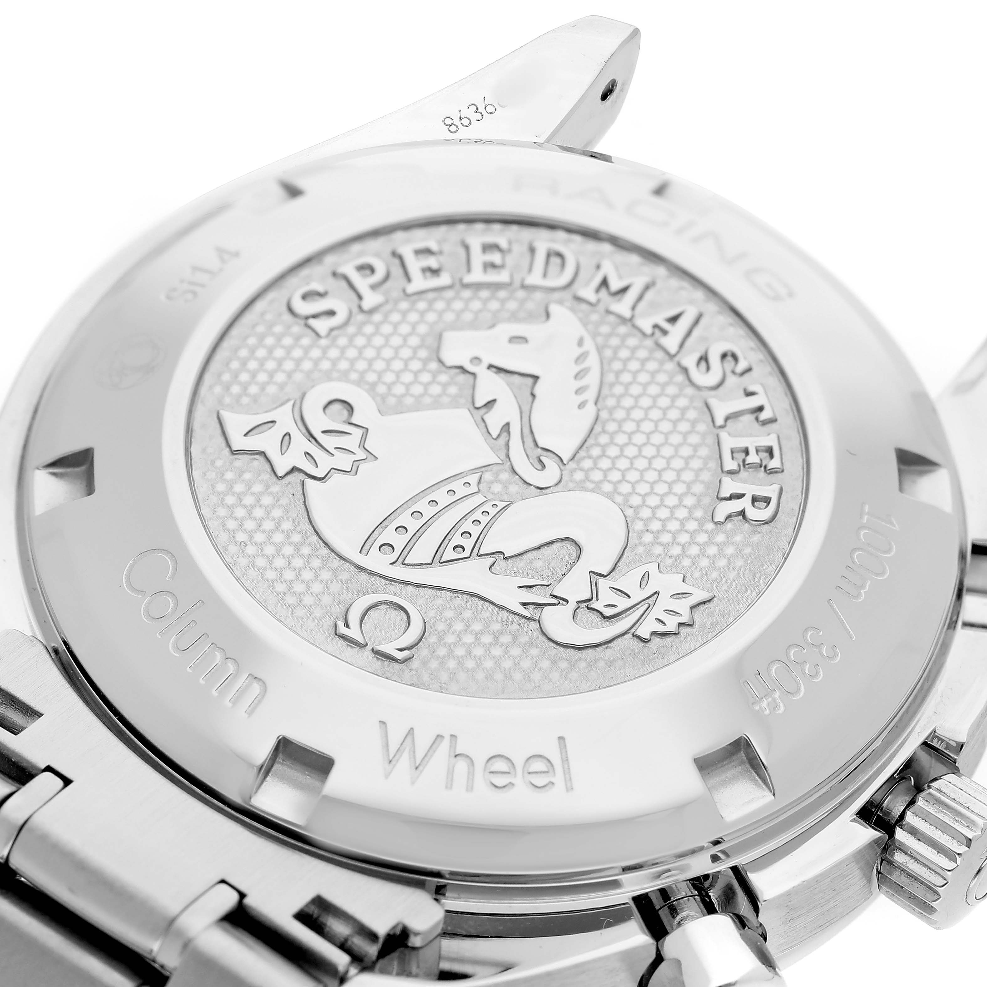 The image shows the case back of an Omega Speedmaster 326.30.40.50.11.001 Men's Stainless Steel Red Dial, displaying engraved details and its emblem.