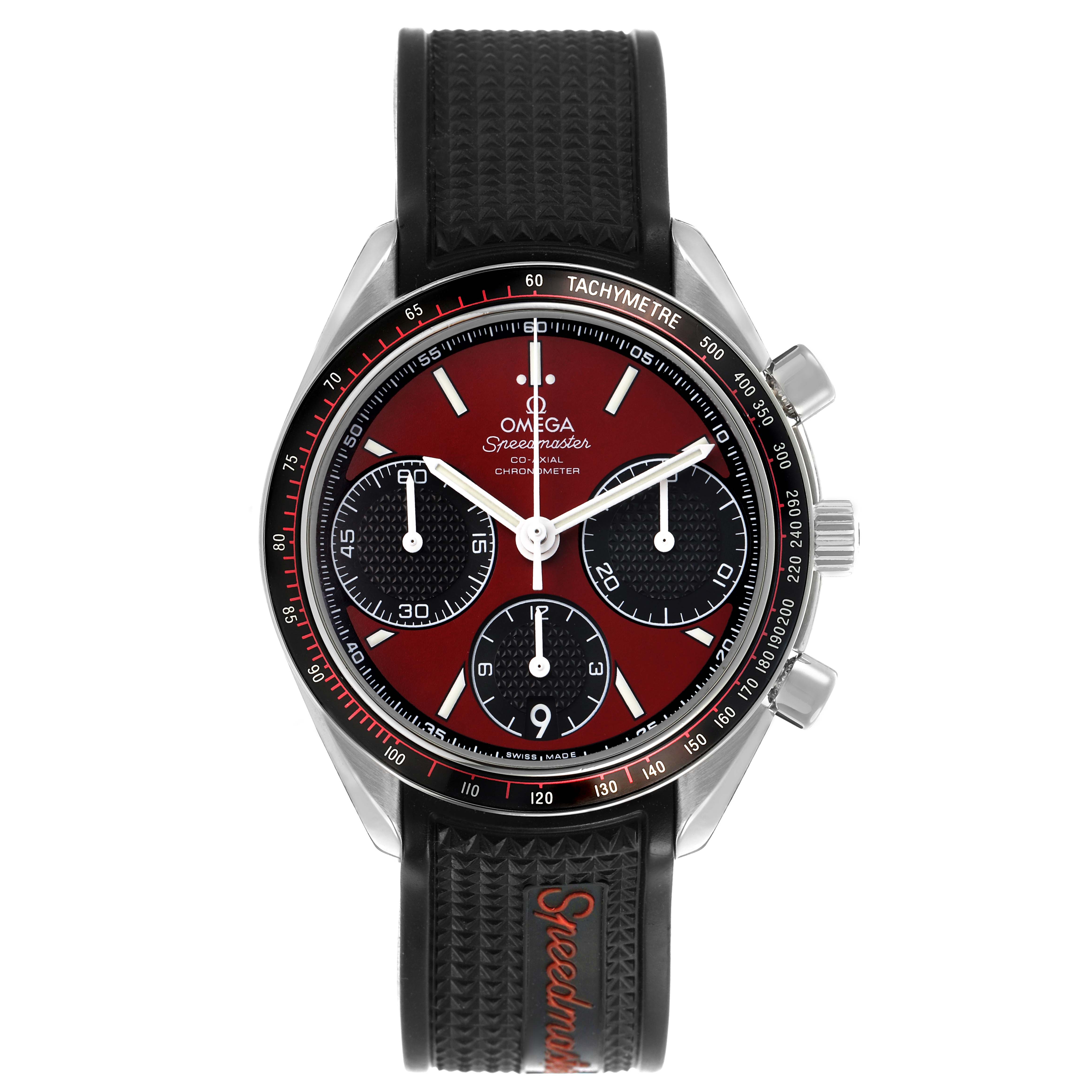 The Omega Speedmaster 326.32.40.50.11.001 Men's Stainless Steel Red Dial watch is shown from a front angle, highlighting its face, bezel, subdials, and textured strap.