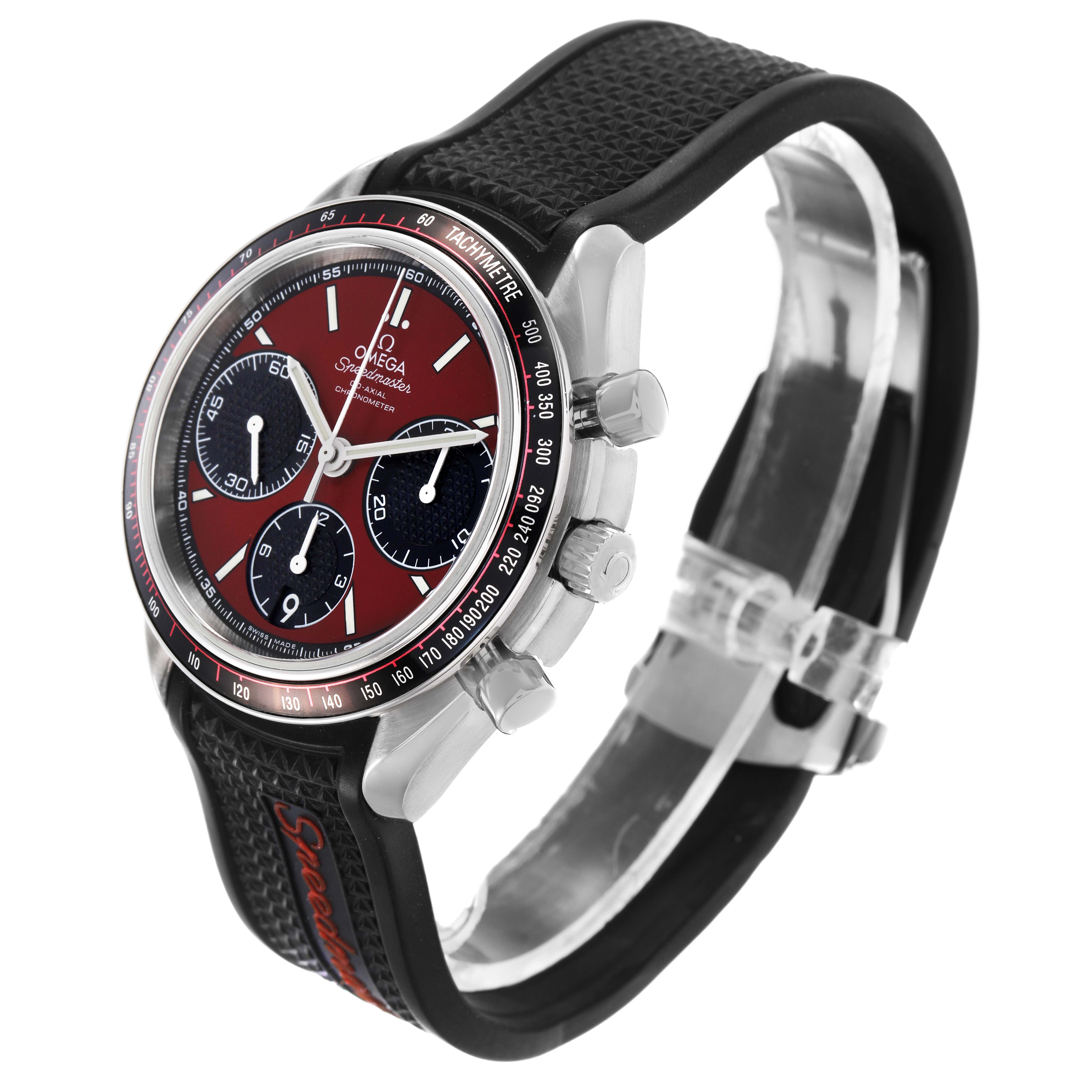The Omega Speedmaster 326.32.40.50.11.001 Men's Stainless Steel Red Dial watch is shown at a three-quarter angle, highlighting its bezel, subdials, and strap details.