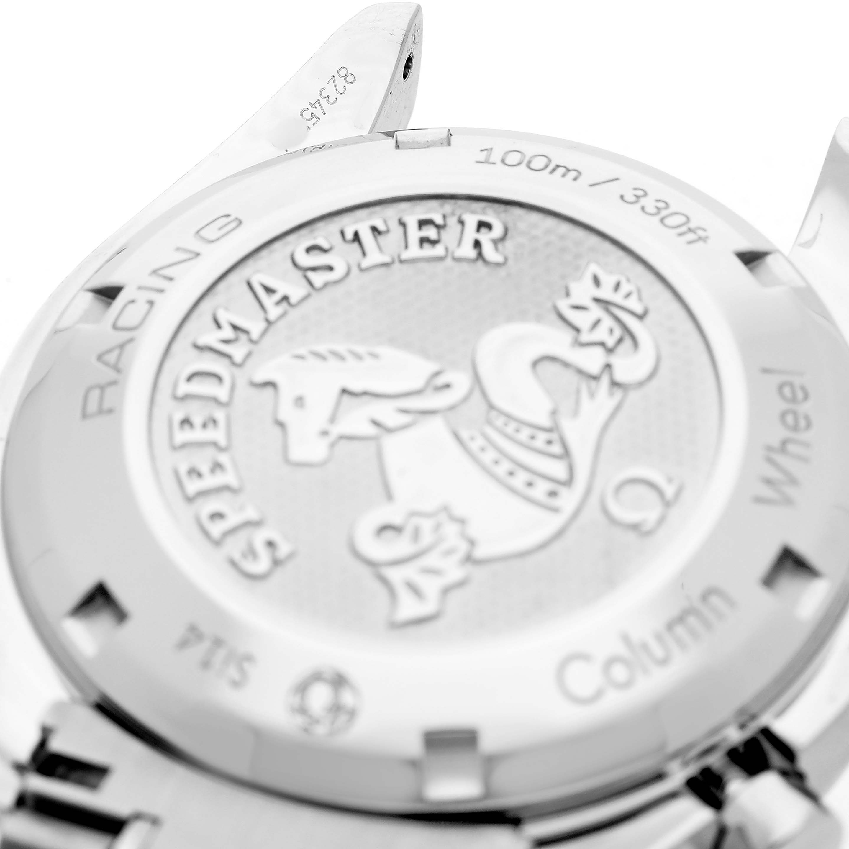 The image shows the back case of an Omega Speedmaster 326.30.40.50.03.001 Men's Stainless Steel Blue Dial, highlighting the engraved logo and text.