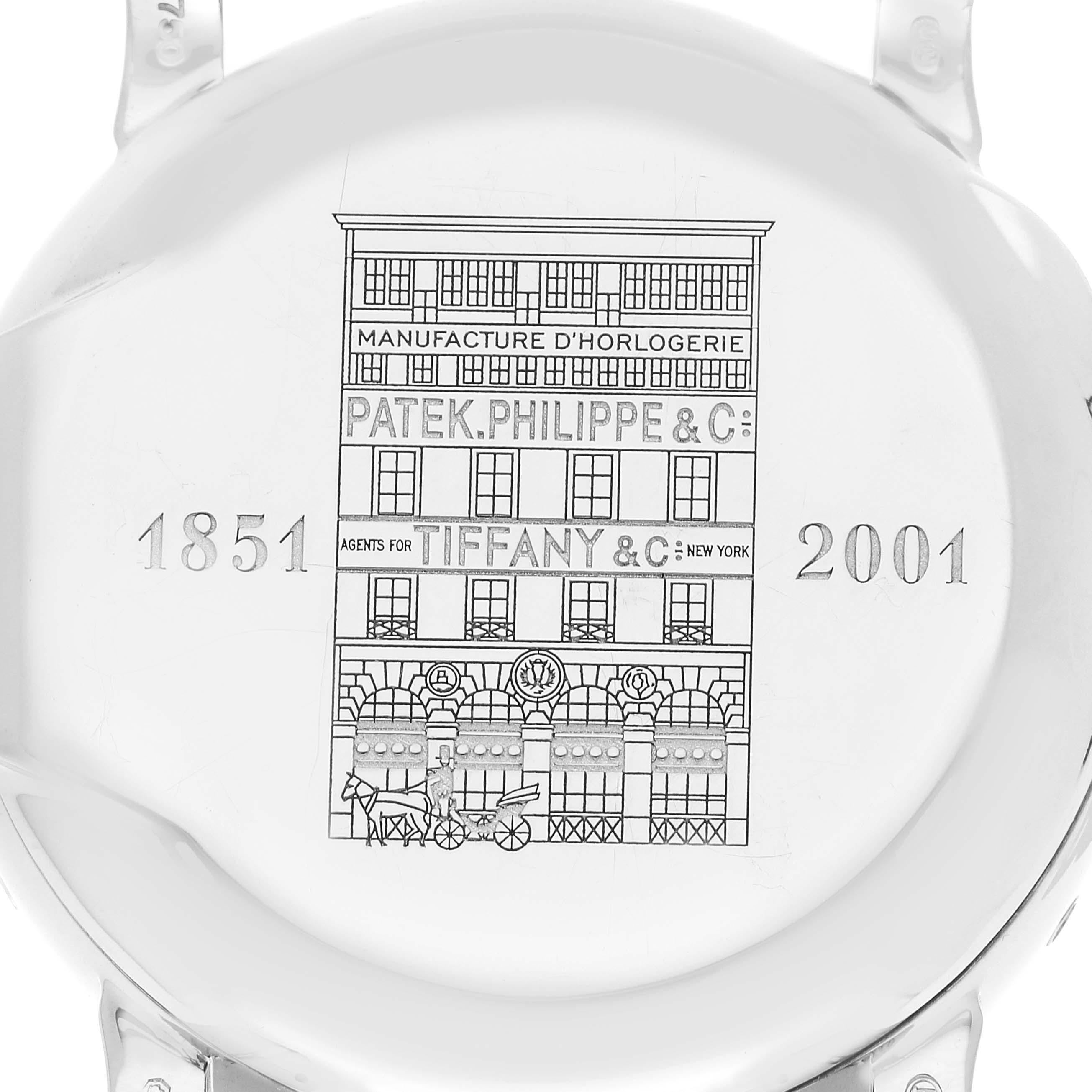 The image shows the engraved case back of a Patek Philippe Complications 5150G Men's White Gold Silver Dial 5150G Men's White Gold Silver Dial watch, featuring historical details and inscriptions.