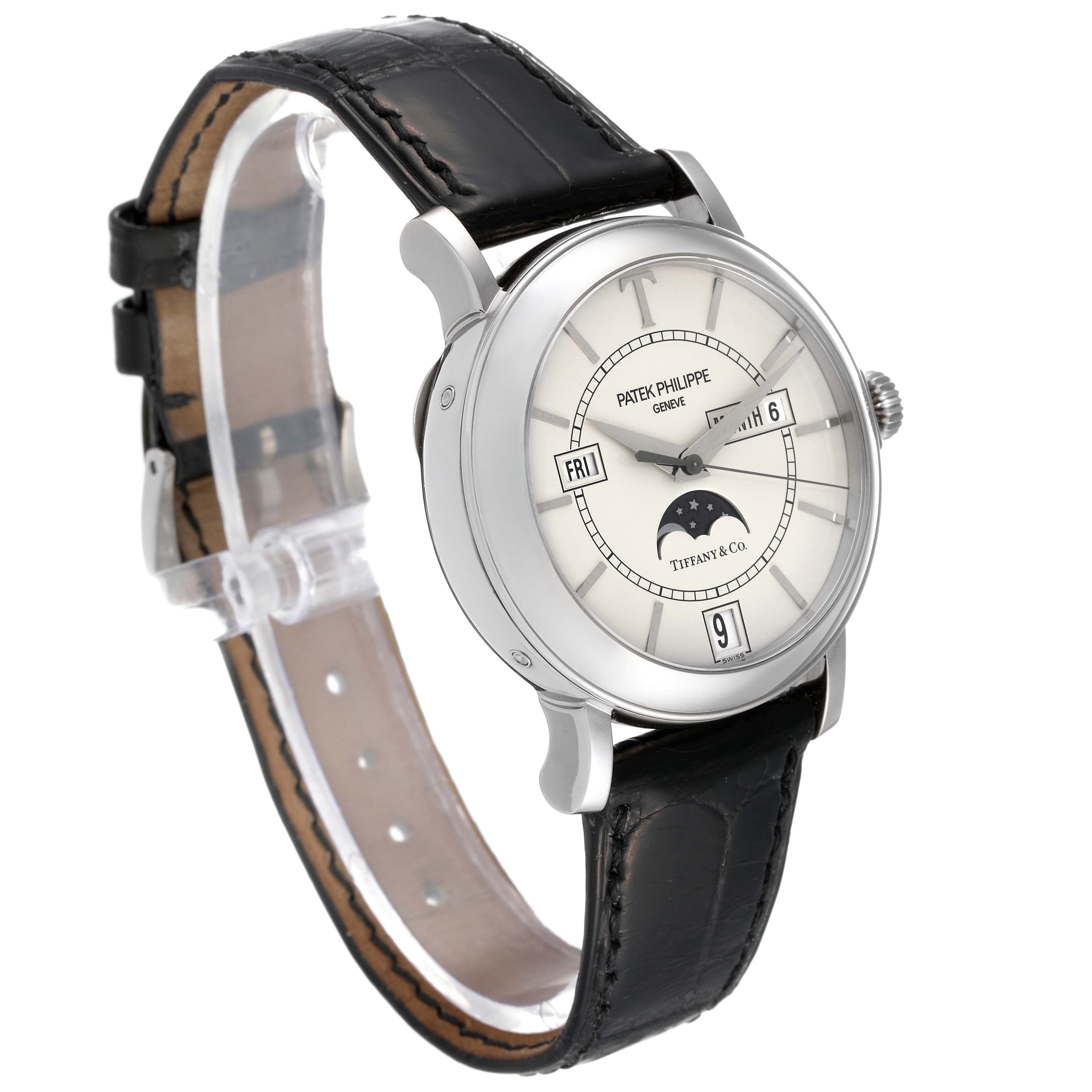 The image shows a Patek Philippe Complications 5150G Men's White Gold Silver Dial 5150G Men's White Gold Silver Dial model watch at an oblique angle, highlighting its face, strap, and crown.