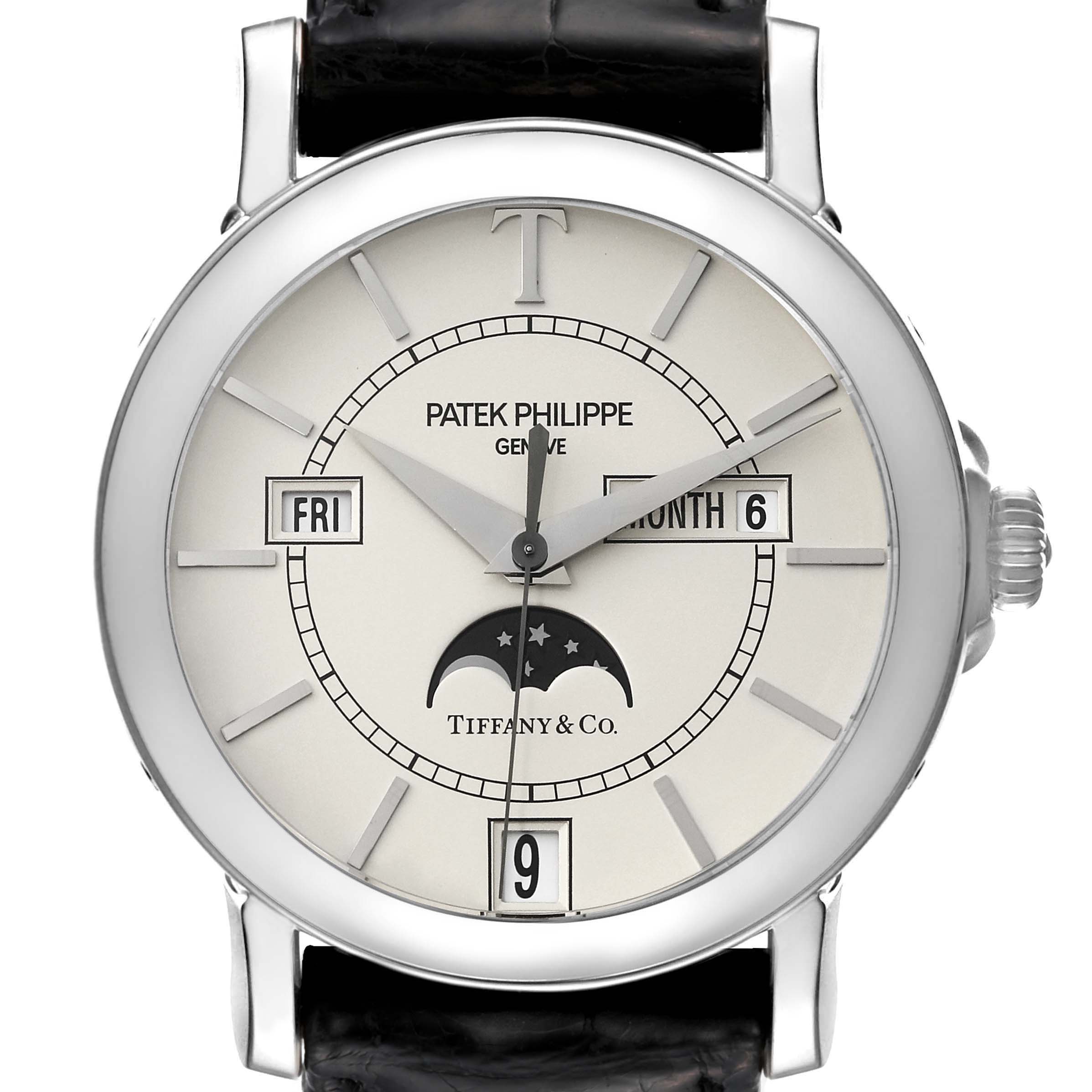 The image shows a front view of the Patek Philippe Complications 5150G Men's White Gold Silver Dial 5150G Men's White Gold Silver Dial watch displaying day, date, month, and moon phase indicators.