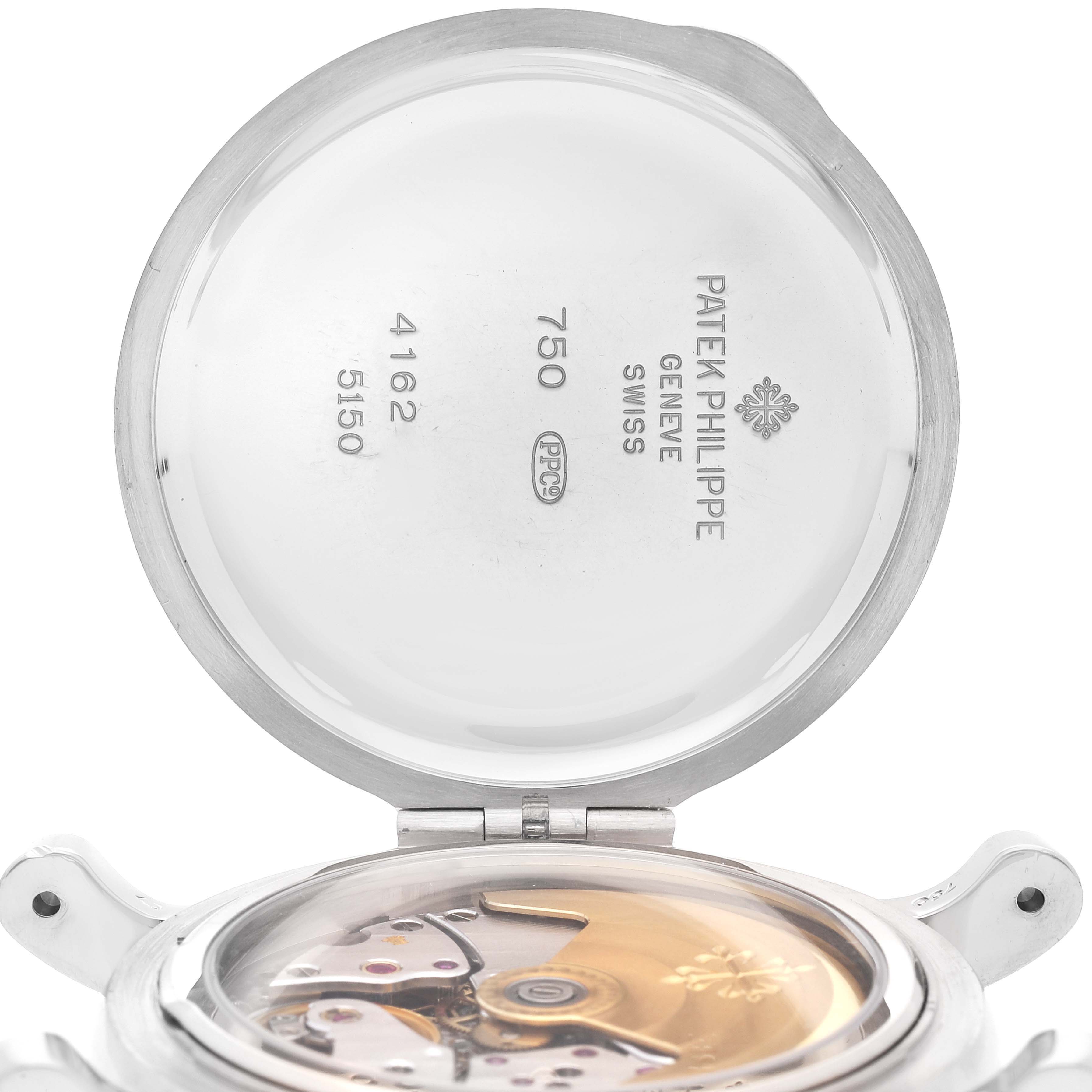 The image shows an open case back of the Patek Philippe Complications 5150G Men's White Gold Silver Dial 5150G Men's White Gold Silver Dial model, revealing the inner mechanism and markings.