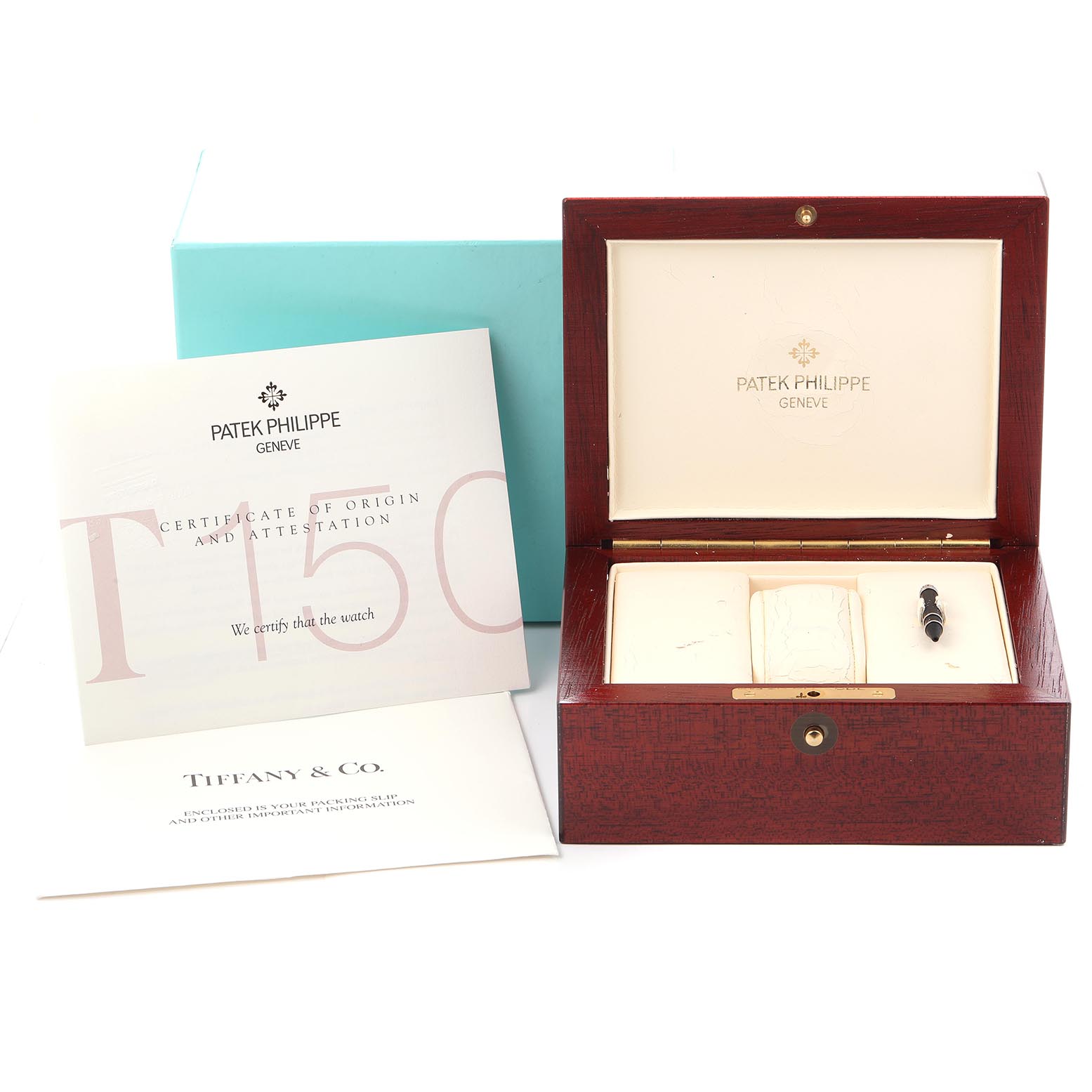 The image shows a Patek Philippe Complications 5150G Men's White Gold Silver Dial 5150G Men's White Gold Silver Dial watch box, certificates, and a tool, viewed from the top front angle.