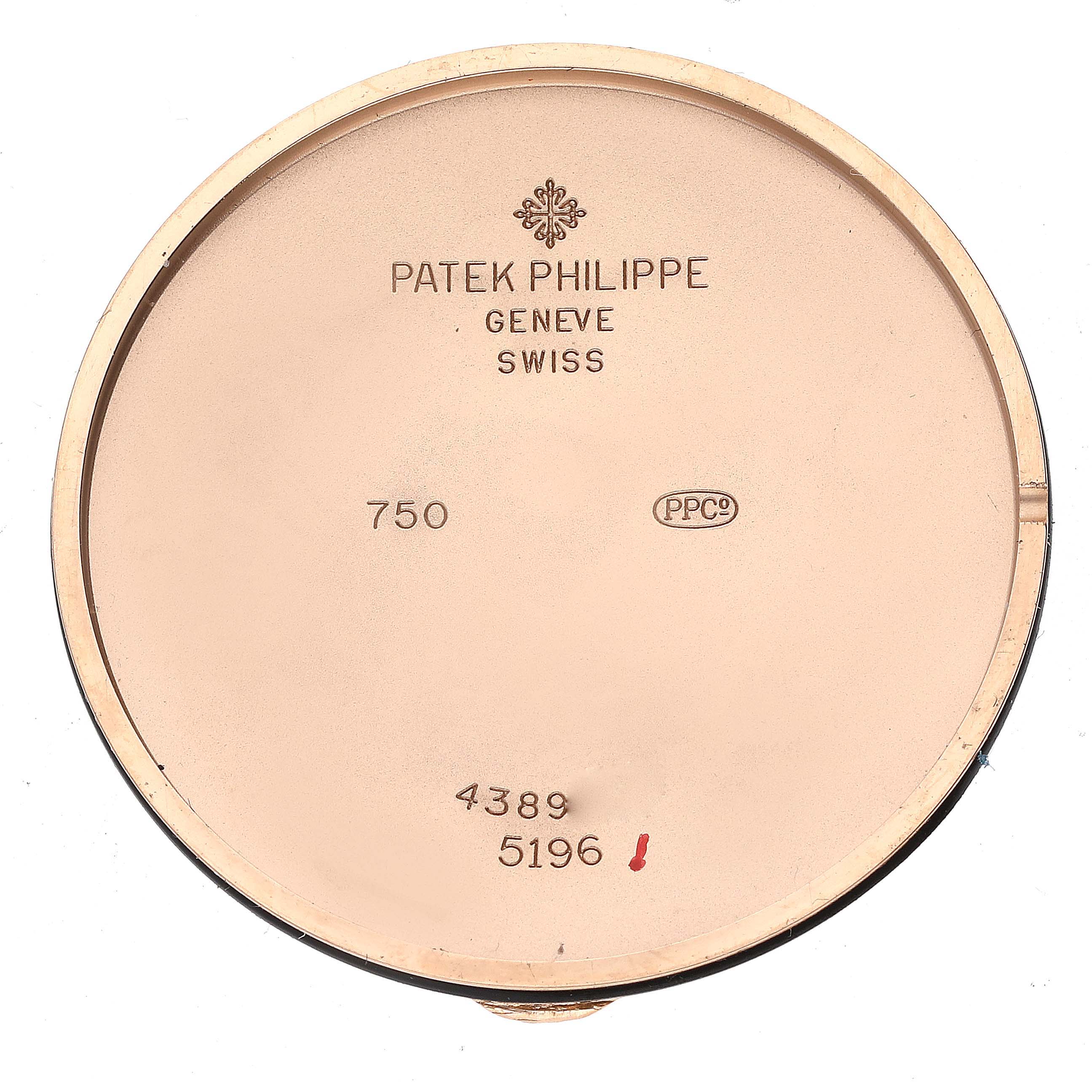The image shows the inner case back of a Patek Philippe Calatrava 5196R Men
s Rose Gold Silver Dial 5196R Men
s Rose Gold Silver Dial watch, displaying engravings with the brand, model, and hallmarks.