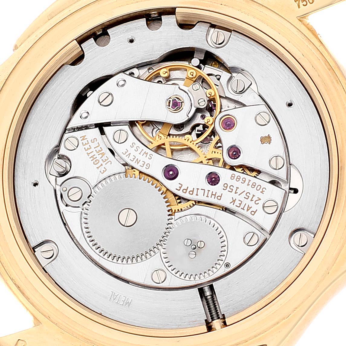 The image shows the intricate mechanical movement of the Patek Philippe Calatrava 5134J Men's Yellow Gold White Dial 5134J Men's Yellow Gold White Dial watch from a close-up angle.