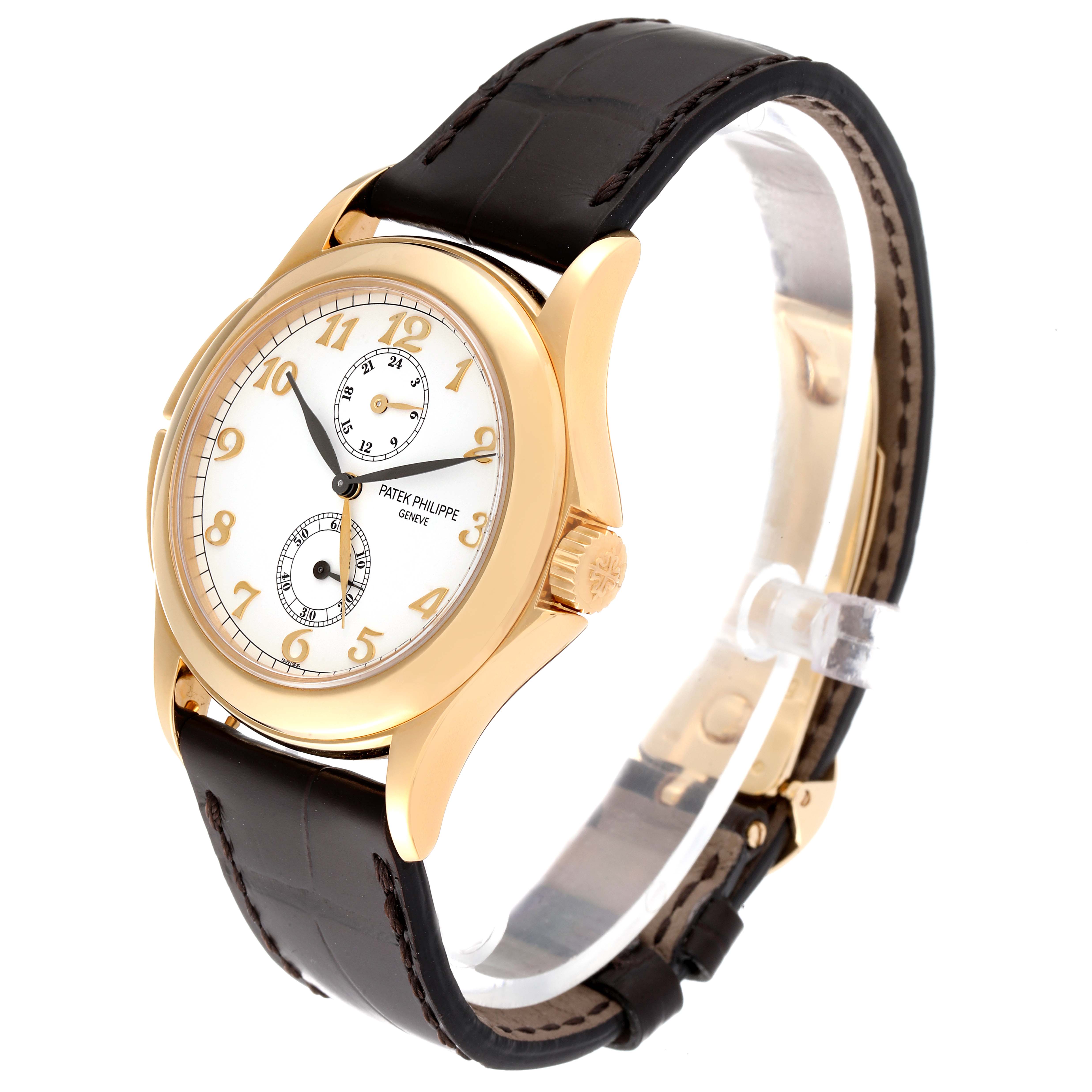 The Patek Philippe Calatrava 5134J Men's Yellow Gold White Dial 5134J Men's Yellow Gold White Dial watch is shown at a slight angle, displaying its gold case, white dial, brown leather strap, and crown detail.