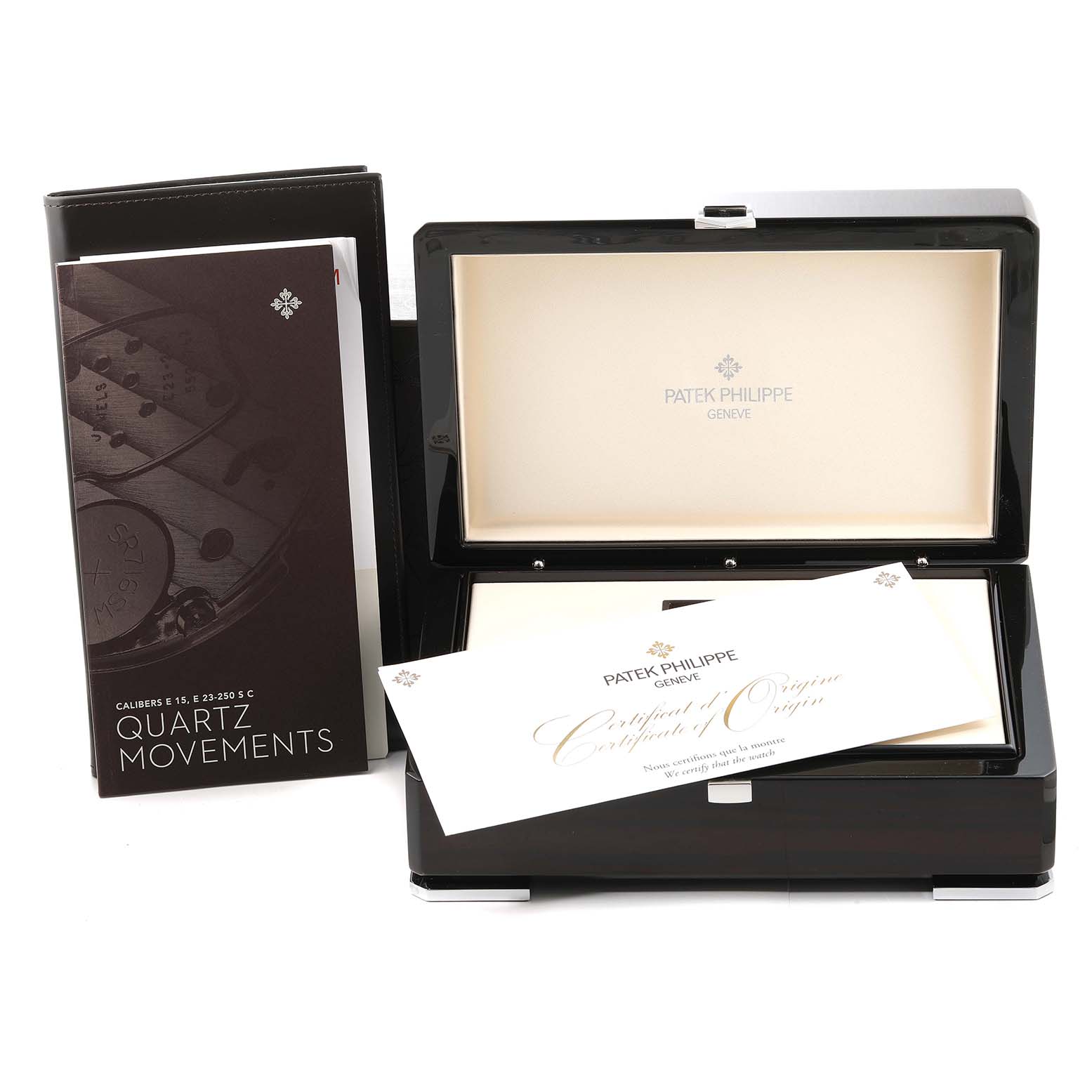 The image displays the packaging, instruction manuals, and certificates for the Nautilus model by Patek Philippe.