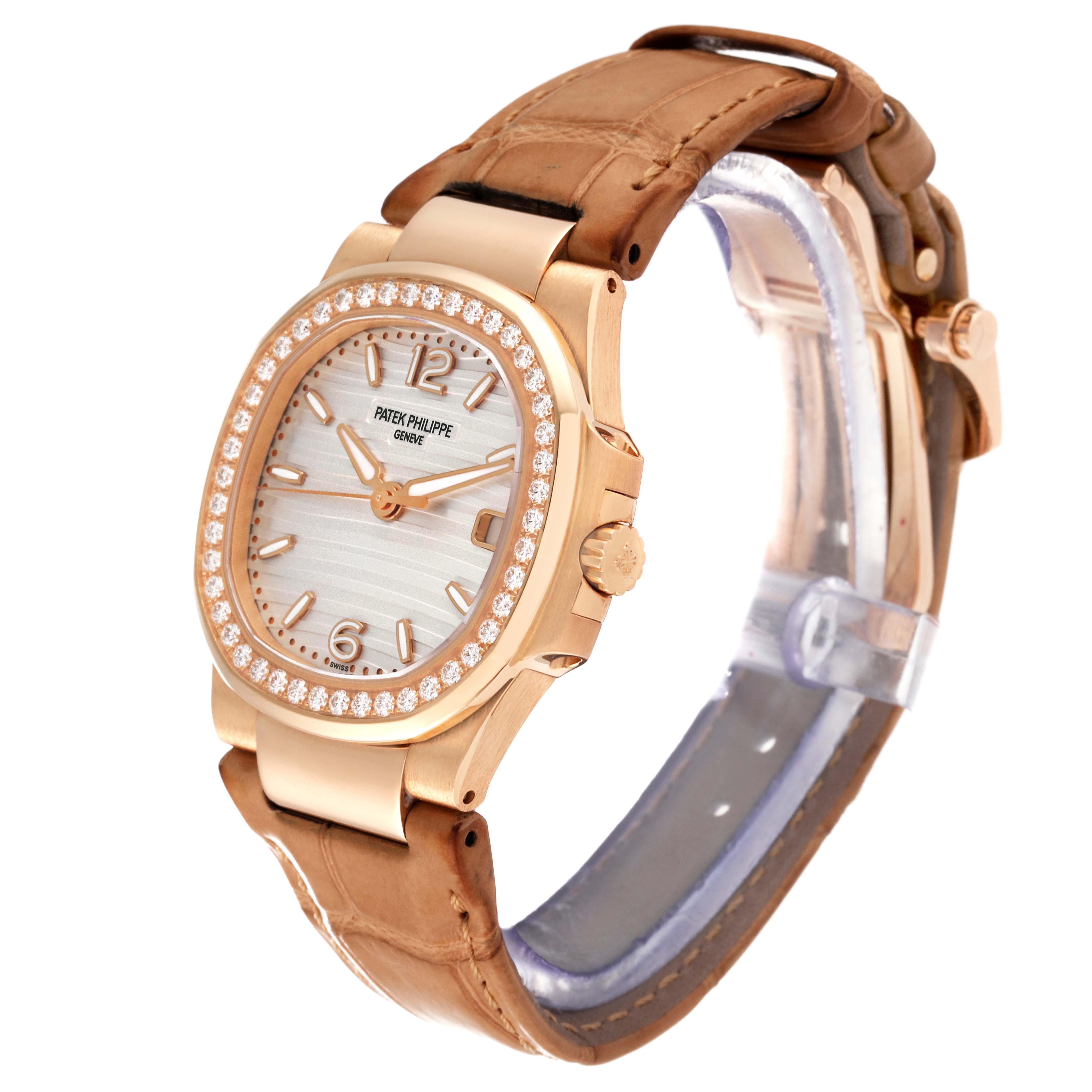 The image shows a side-angle view of a Patek Philippe Nautilus 7010R Women's Rose Gold Silver Dial 7010R Women's Rose Gold Silver Dial watch, highlighting its dial, bezel, crown, and leather strap.