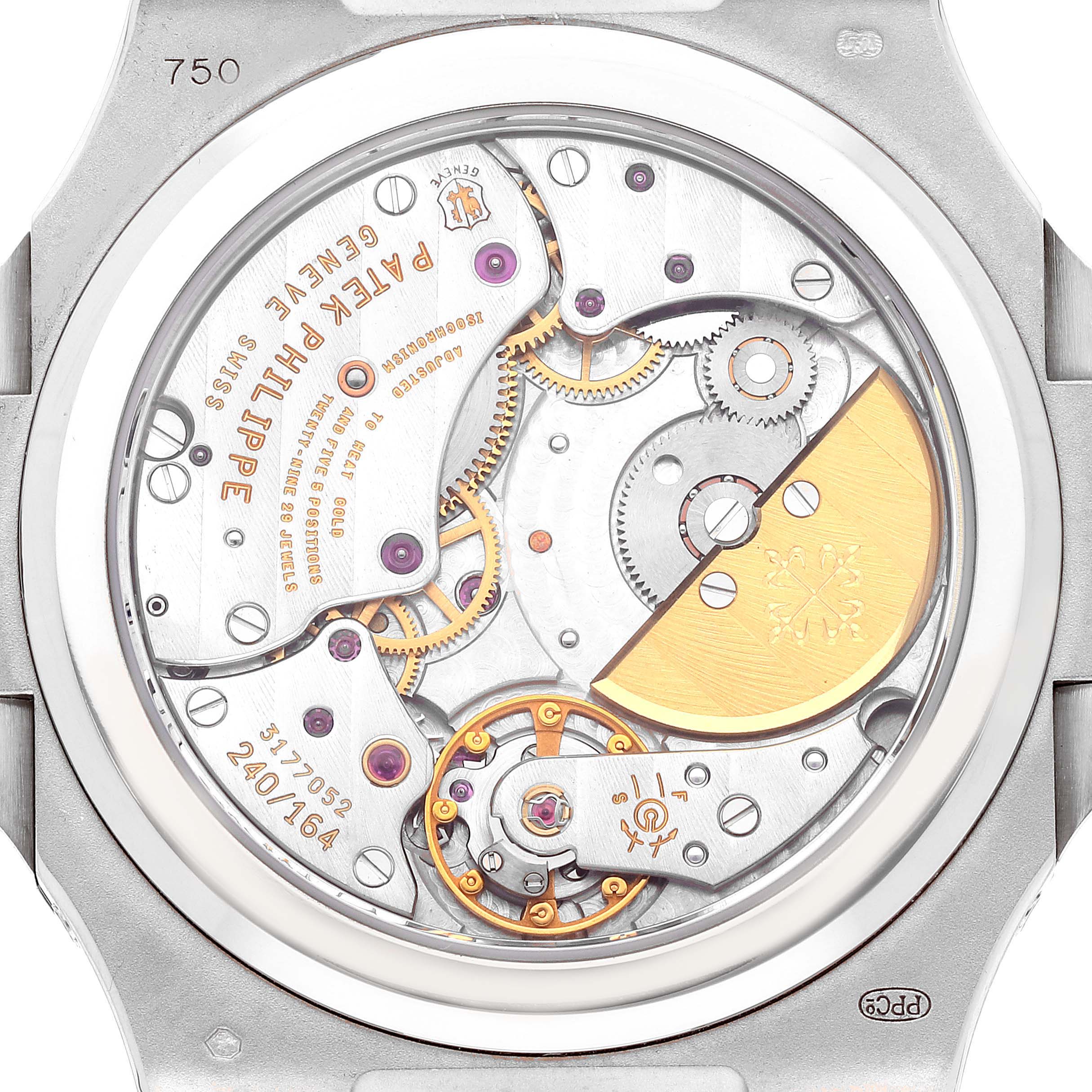 This image shows the back view of a Patek Philippe Nautilus 5712G-001 Men's White Gold Grey Dial 5712G-001 Men's White Gold Grey Dial watch, highlighting its inner mechanical movements.