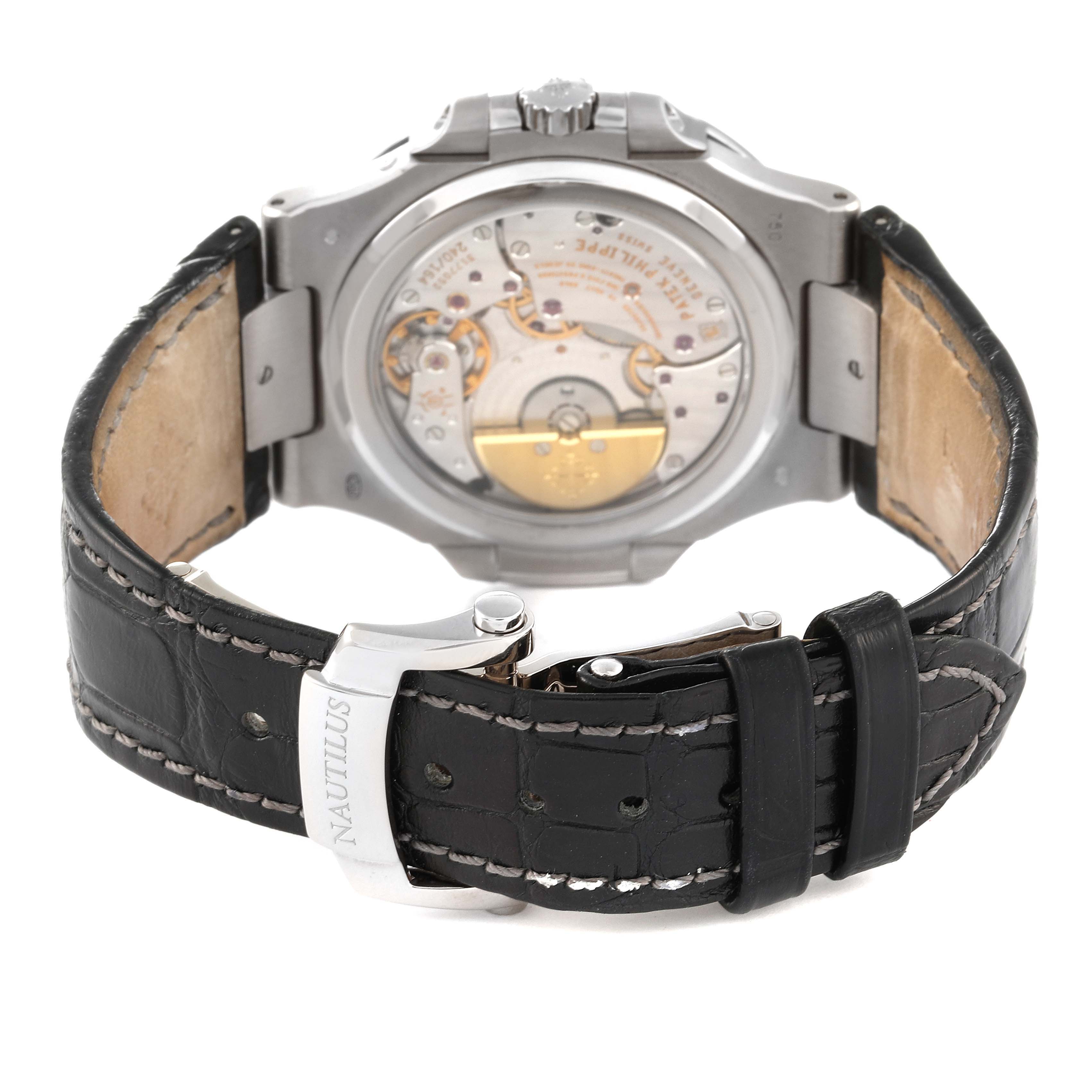The image shows the back view of a Patek Philippe Nautilus 5712G-001 Men's White Gold Grey Dial 5712G-001 Men's White Gold Grey Dial watch, highlighting its movement and black leather strap.