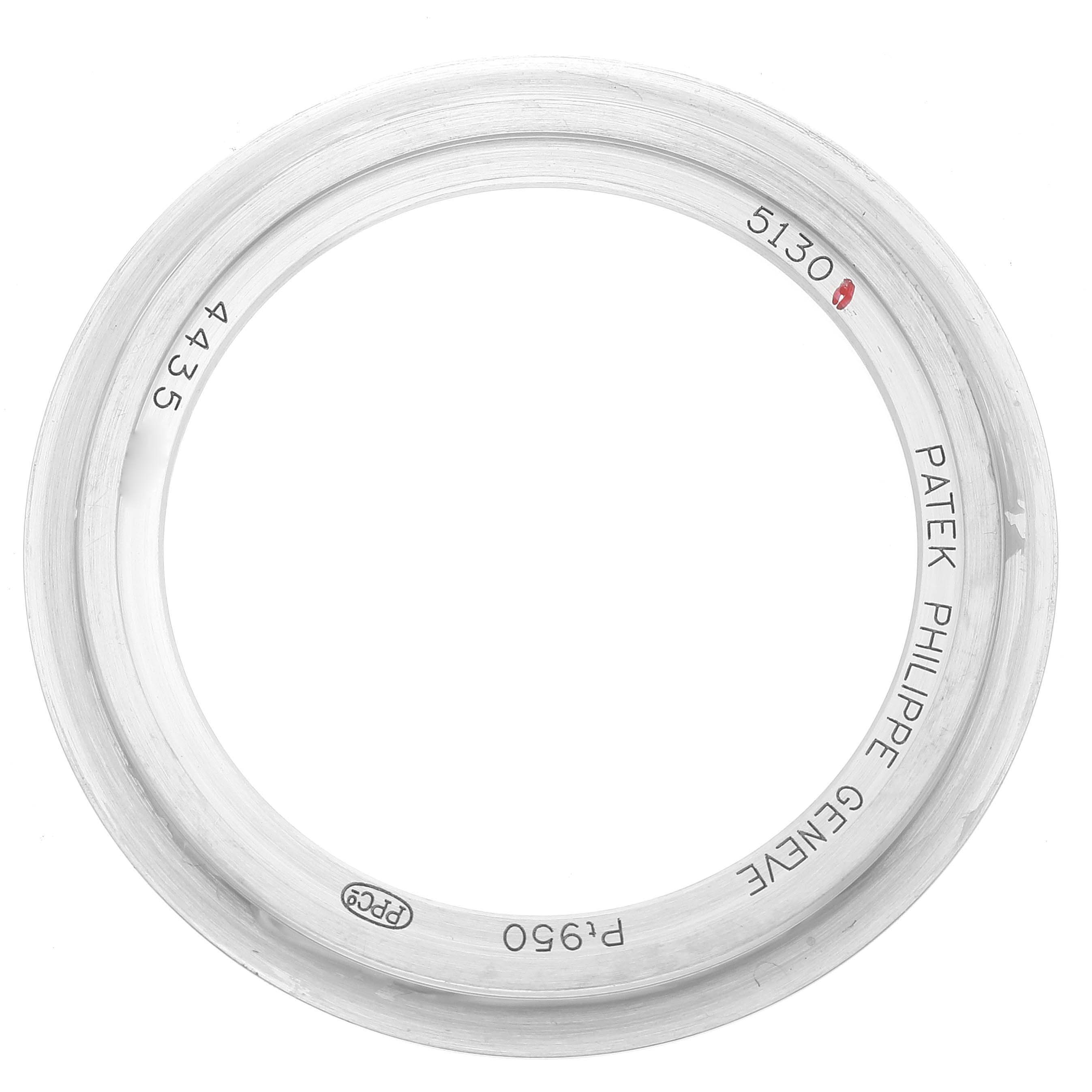 This image shows a stainless steel bezel for the Patek Philippe Complications 5130P-001 Men's Platinum Silver Dial 5130P-001 Men's Platinum Silver Dial model 5130, engraved with brand details and marks.