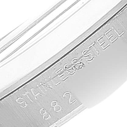 This angled shot displays the engraved side of the bezel from a Vintage Collection Rolex watch, highlighting "STAINLESS STEEL".