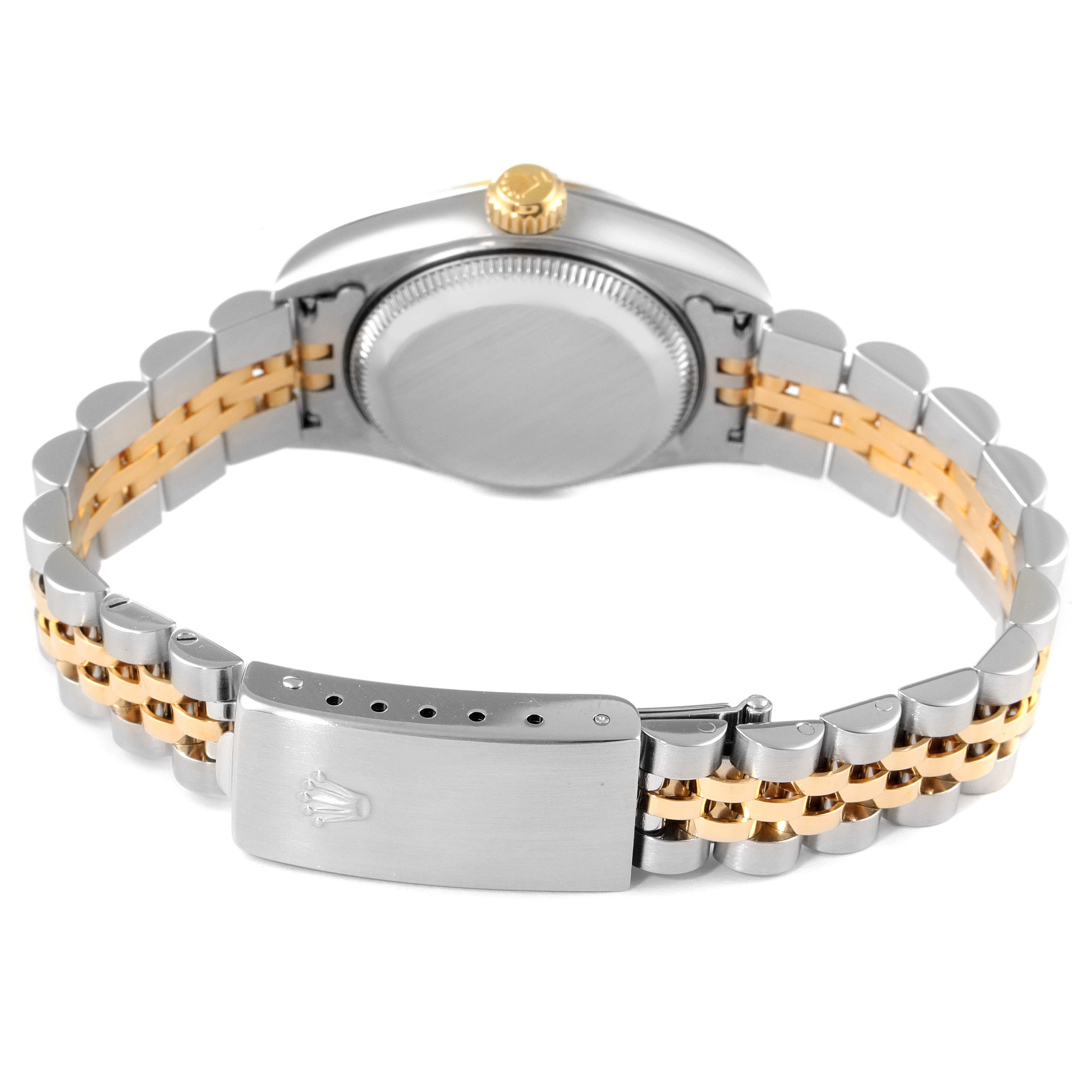 The image shows the back view of a Rolex Datejust 79173 Women
s Steel and Gold (two tone) White Dial 79173 Women
s Steel and Gold (two tone) White Dial watch focusing on its clasp, bracelet, and case back.
