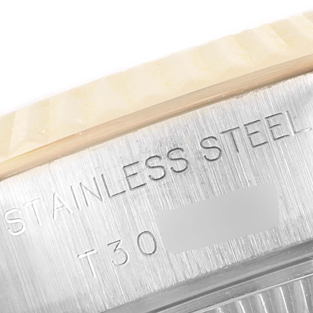 This close-up image shows the stainless steel engraving on the side of a Rolex Datejust 69173 Women
s Steel and Gold (two tone) Champagne Dial 69173 Women
s Steel and Gold (two tone) Champagne Dial watch case.