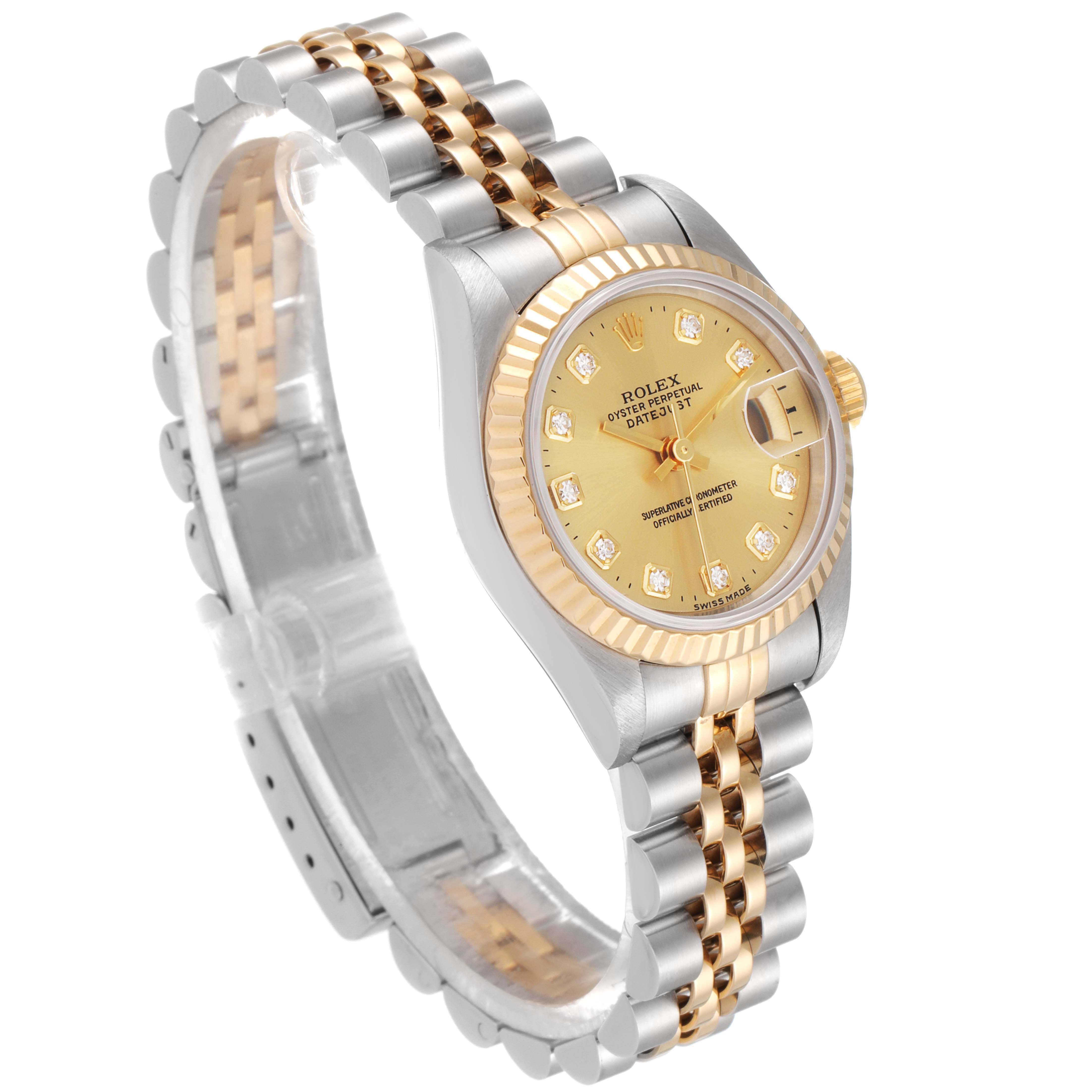 The image shows a Rolex Datejust 69173 Women
s Steel and Gold (two tone) Champagne Dial 69173 Women
s Steel and Gold (two tone) Champagne Dial watch at a slight overhead angle, focusing on its two-tone bracelet, fluted bezel, and champagne-colored dial.