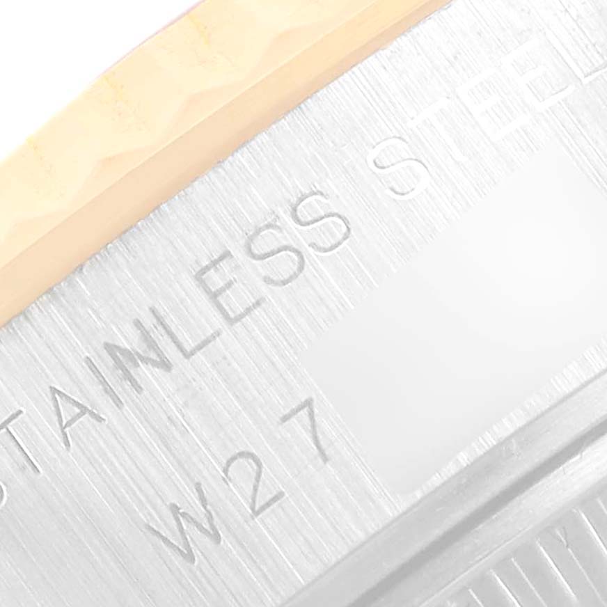 The close-up image shows the engraved text "STAINLESS" and "W27" on the metal back of a Rolex Datejust 69173 Women's Steel and Gold (two tone) Champagne Dial 69173 Women's Steel and Gold (two tone) Champagne Dial watch.