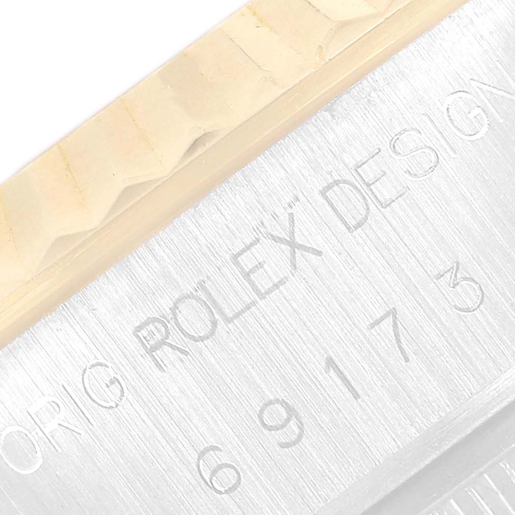 The image shows a close-up view of the bezel and serial number engraving on the Rolex Datejust 69173 Women's Steel and Gold (two tone) Champagne Dial 69173 Women's Steel and Gold (two tone) Champagne Dial watch.