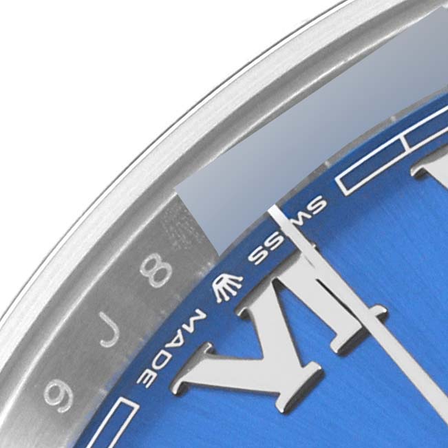 This is a close-up of the dial and bezel of a Rolex Datejust 41 126300 Men
s Stainless Steel Blue Dial 126300 Men
s Stainless Steel Blue Dial, showcasing a portion of the blue face, minute, and roman numeral markers.
