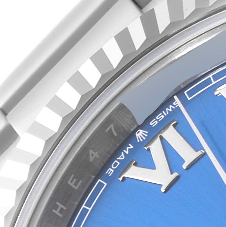 This close-up image of a Rolex Datejust 41 126334 Men
s Stainless Steel Blue Dial 126334 Men
s Stainless Steel Blue Dial highlights part of the bezels and the dial with Roman numerals.