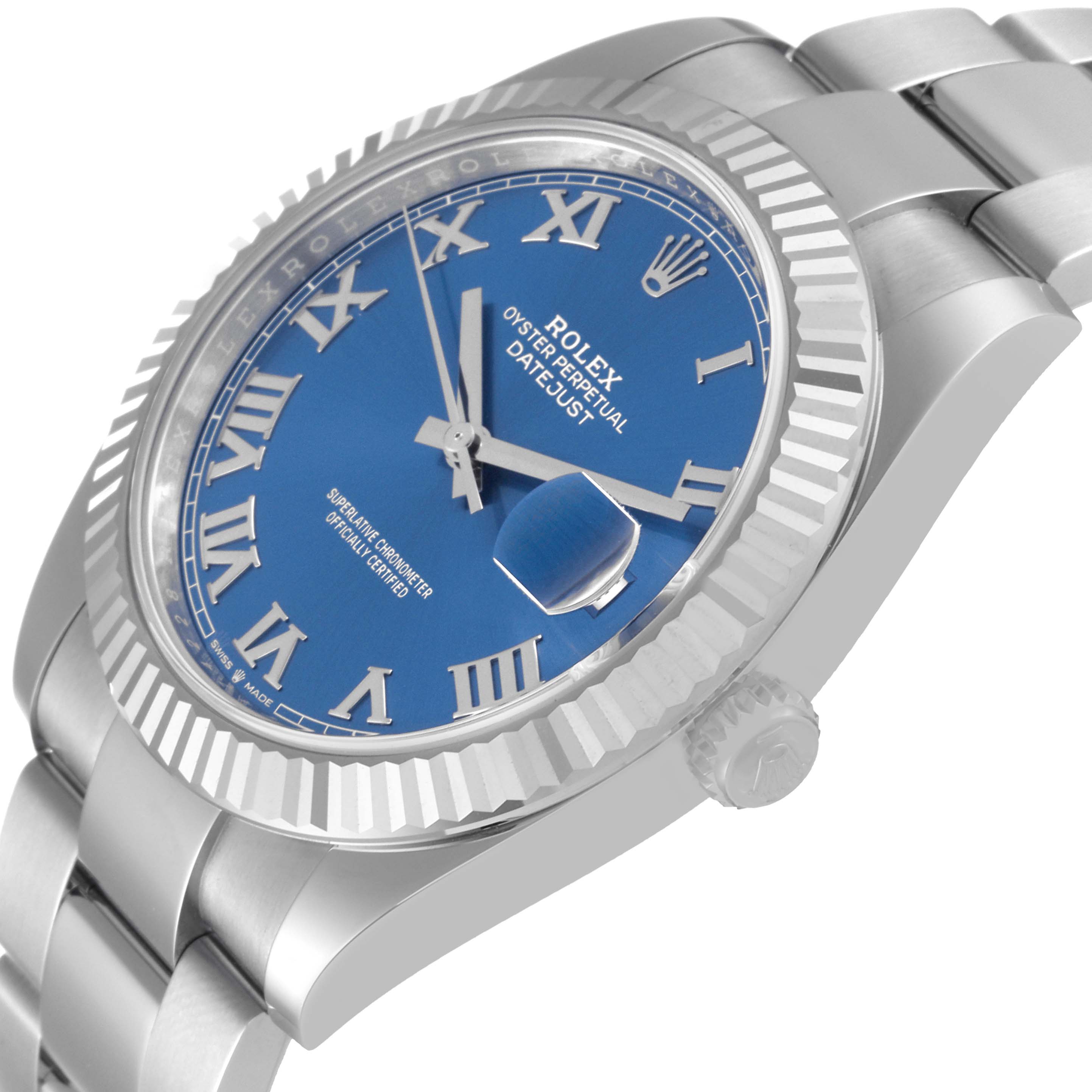 The image shows a side angle of the Rolex Datejust 41 126334 Men
s Stainless Steel Blue Dial 126334 Men
s Stainless Steel Blue Dial, highlighting its blue dial, Roman numerals, fluted bezel, and part of the band.
