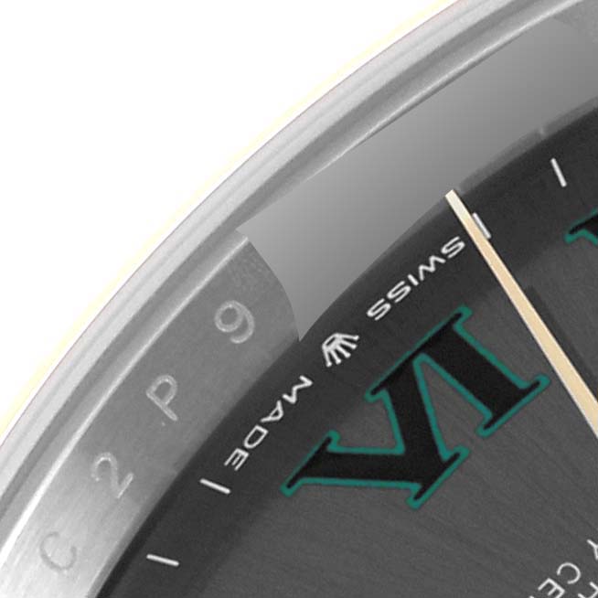 The image shows a close-up of the dial and bezel of a Rolex Datejust 41 126303 Men's Steel and Gold (two tone) Grey Dial 126303 Men's Steel and Gold (two tone) Grey Dial, featuring part of the VI numeral and "Swiss Made" text.