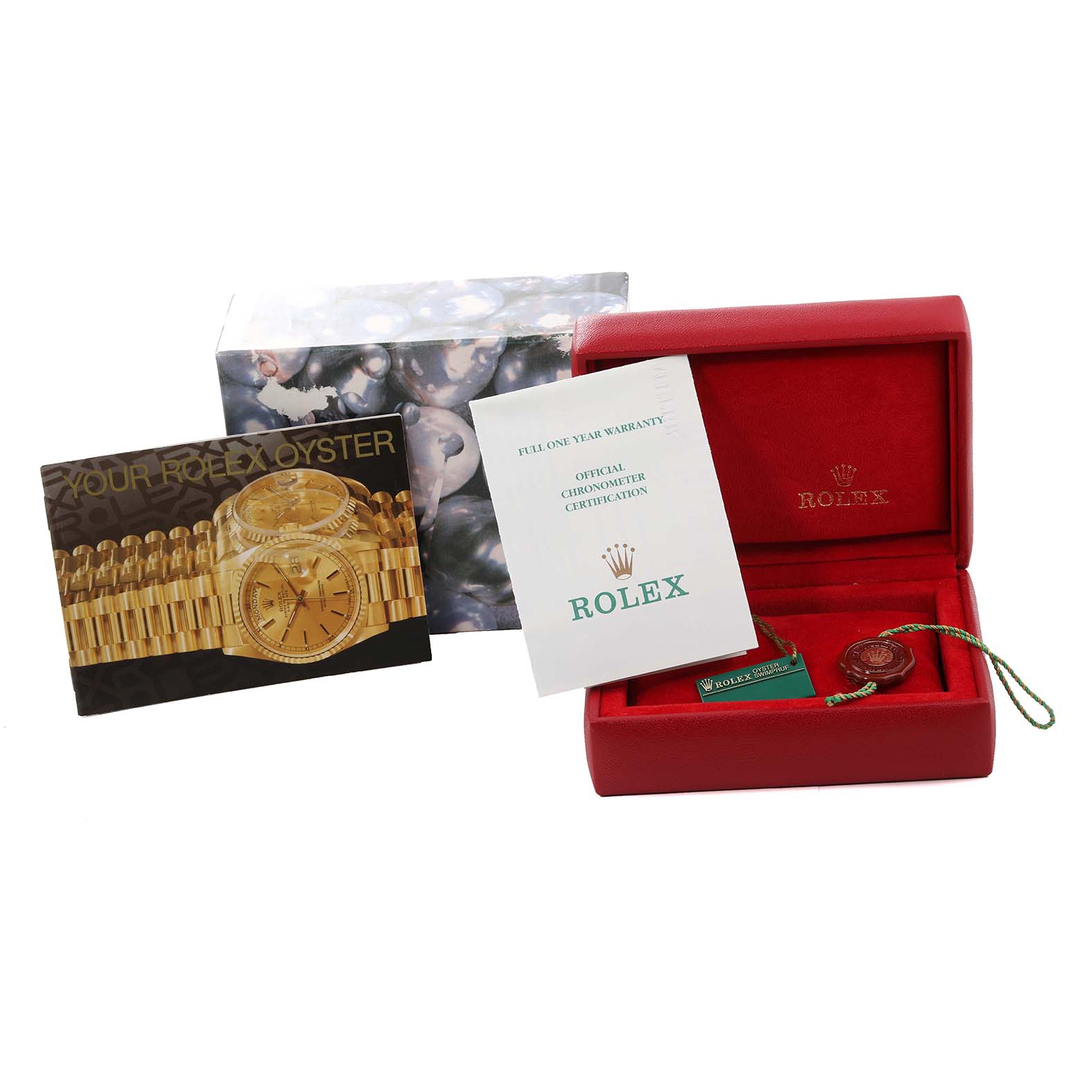 The Rolex Datejust 79173 Women's Steel and Gold (two tone) Champagne Dial 79173 Women's Steel and Gold (two tone) Champagne Dial watch accessories include a red box, warranty certificate, booklet, and tags.