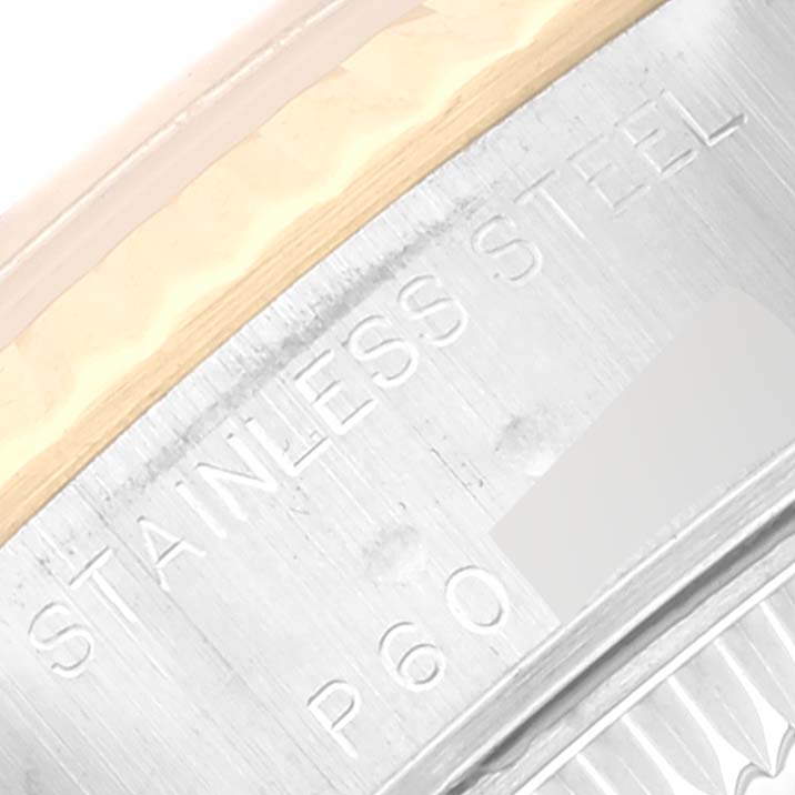 This close-up image shows part of the case back of a Rolex Datejust 79173 Women's Steel and Gold (two tone) Champagne Dial 79173 Women's Steel and Gold (two tone) Champagne Dial, highlighting the "STAINLESS STEEL" engraving.