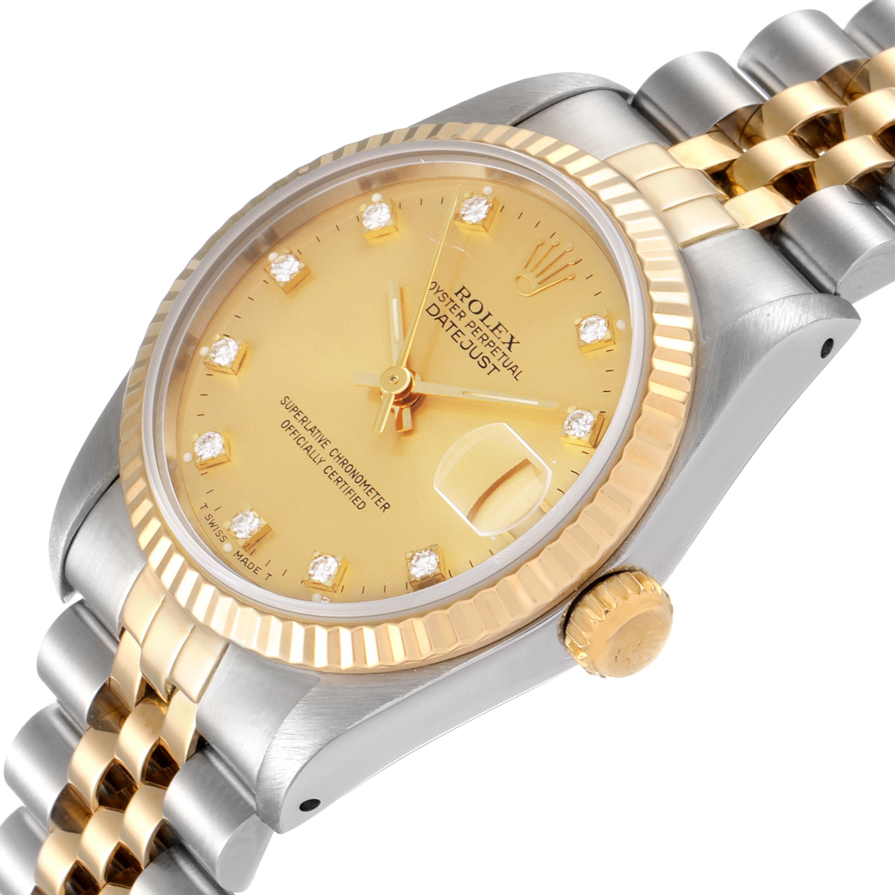 This Rolex Mid-Size 68273 Women's Steel and Gold (two tone) Champagne Dial 68273 Women's Steel and Gold (two tone) Champagne Dial Datejust watch is shown from an angled perspective, featuring its dial, fluted bezel, crown, and bracelet.