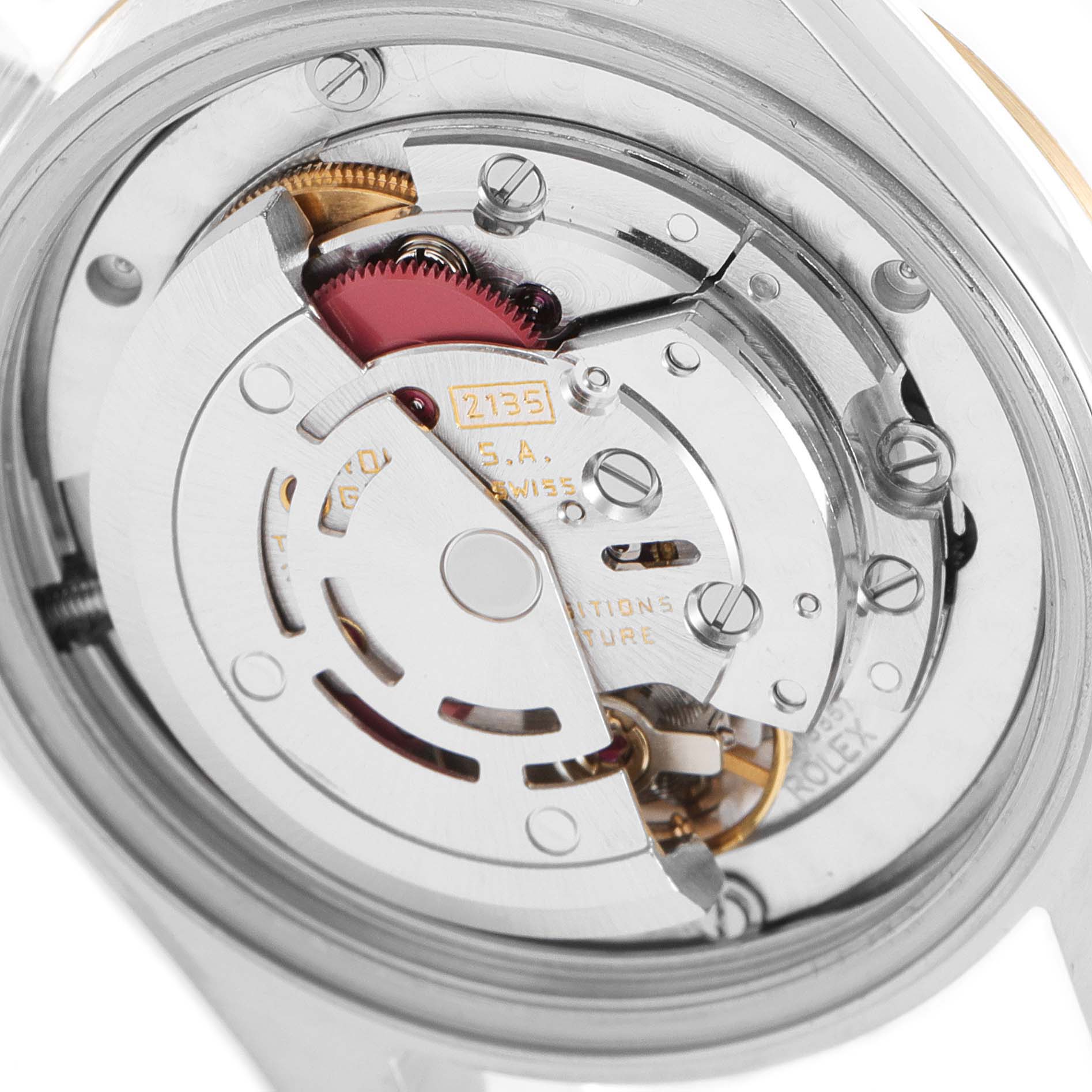 The image shows a close-up view of the movement inside a Mid-Size Rolex watch.